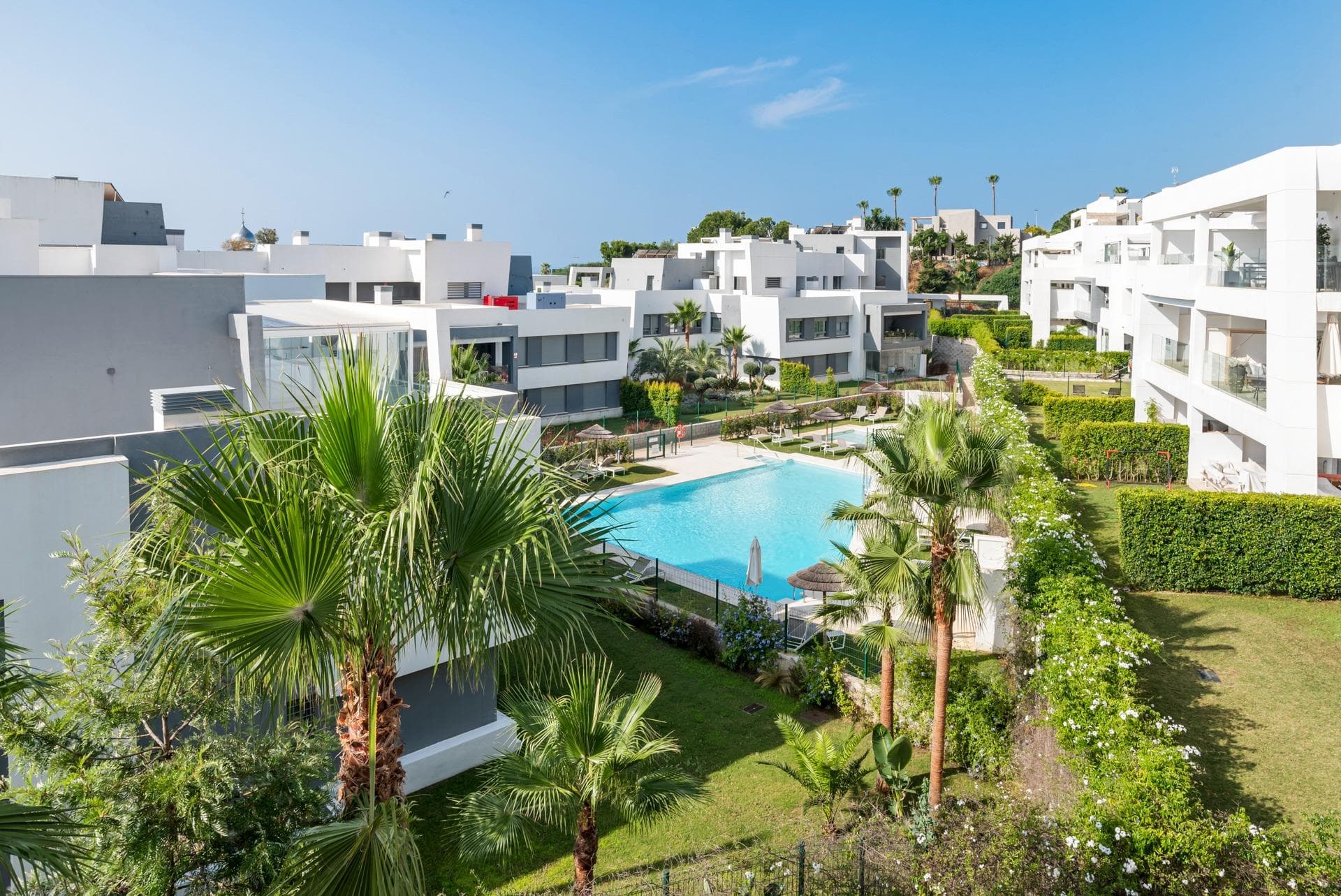 Situated in the sought-after Vanian Green Village – Phase 2 in the Selwo area of Estepona, this stylish and contemporary 2-bedroom penthouse offers a perfect blend of modern comfort and tranquil surroundings. Located on the second floor with east to southeast orientation, the property is bathed in natural light throughout the day. Built in 2018, it features a smart layout and high-quality finishes throughout. Inside, you’ll find: A welcoming entrance hallway Bright and airy open-plan living and dining area Fully fitted modern kitchen with premium appliances Separate laundry room for convenience Master bedroom with en-suite bathroom and built-in wardrobes Guest bedroom with a separate full bathroom Both the living room and master bedroom open onto a spacious partially covered terrace—ideal for al fresco dining, relaxing, or entertaining, all while enjoying open views and a peaceful atmosphere. Additional Highlights: Underground parking space Large private storage room Air conditioning with heating Stylish modern furnishings included Set within a secure gated community, residents have access to beautifully landscaped gardens, multiple swimming pools, a spa, gym, and even a cinema room. Conveniently located near schools and amenities, the penthouse is just a 10-minute drive from both Estepona town centre and Puerto Banús, with Marbella a short distance beyond—making this an ideal home for year-round living or a luxurious holiday retreat on the Costa del Sol.