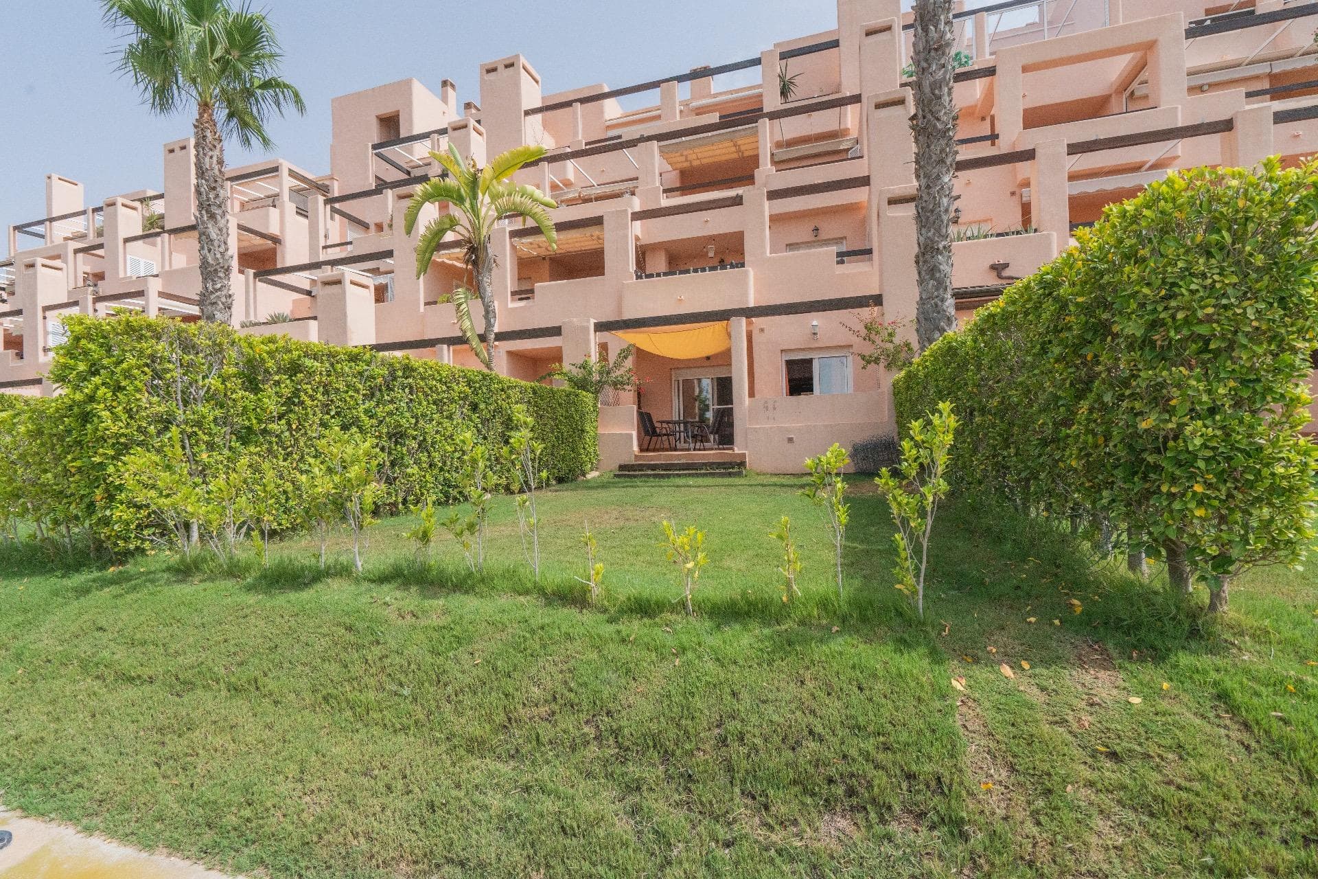 This beautiful 2-bedroom ground-floor apartment is located in the exclusive La Isla development, one of the most sought-after areas within Condado de Alhama Golf Resort. The property boasts a large private back garden with stunning views directly over the lake and communal pool, creating the perfect setting for relaxing, entertaining, or enjoying the sunshine all year round. Inside, the apartment offers a bright and modern open-plan living space, a fully fitted kitchen, two spacious bedrooms with built-in wardrobes, and a family bathroom. The living room opens seamlessly onto the terrace and garden, making the most of the tranquil setting and natural light. La Isla is a gated community with 24-hour security, beautifully landscaped gardens, and access to multiple swimming pools. Just a short stroll away, you’ll find restaurants, bars, a supermarket, sports facilities, and of course, the world-class Jack Nicklaus Signature Golf Course. Whether you’re looking for a holiday retreat, rental investment, or permanent home in the sun, this property offers exceptional value in a truly unbeatable location.