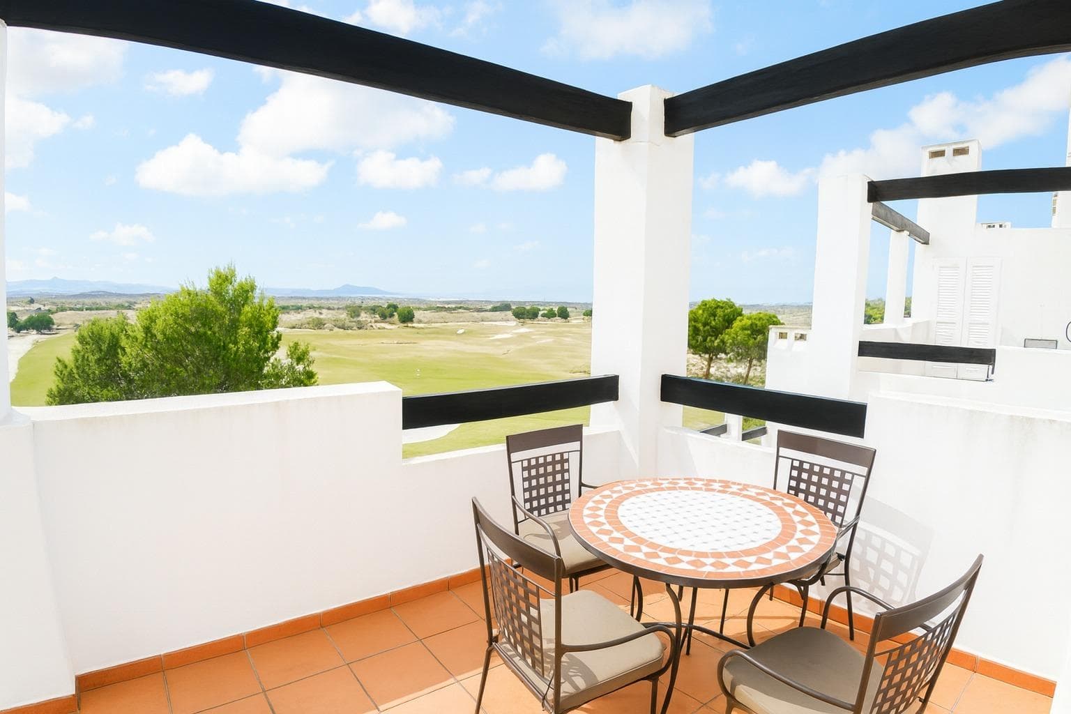 2 bed Apartment with Golf course views Wake up to sweeping fairway views, endless sunshine, and unforgettable sunsets from this beautiful two-bedroom 2nd floor penthouse apartment, perfectly positioned on the front line of the Jack Nicklaus–designed golf course at the highly sought-after Condado de Alhama resort. This prime, elevated home enjoys south to south-west facing terraces, offering sunshine from mid-morning through to evening and arguably some of the finest golf views on the entire resort. Whether you’re sipping your morning coffee or enjoying a sunset dinner, the outlook is simply spectacular. Highlights at a Glance:- Spacious private terrace ideal for al fresco dining, relaxing, and entertaining Fully furnished & Free WiFi Air conditioning for year-round comfort (hot and cold) Allocated outside private parking space Access to a beautifully maintained communal pool 24-hour gated security for complete peace of mind Walking distance to the Club House and Commercial centre Inside the Apartment:- Step inside to discover a light-filled, welcoming interior designed for both comfort and style. The lounge and bedrooms are enhanced with great furniture that add warmth and character, while modern kitchen is equipped with stylish silver appliances, making it both practical and visually appealing. Both bedrooms feature double storage beds and fitted wardrobes, offering excellent storage without compromising on space or design. The penthouse layout ensures privacy and a sense of openness, creating a home that feels both relaxed and refined. Outdoor Living at Its Best:-The large private terrace is the star of the show—an inviting outdoor space where you can unwind, entertain, or simply take in the breathtaking sunsets over the golf course and surrounding mountains. With outdoor furniture already in place, it’s ready to enjoy from day one. Set in the heart of Murcia, Condado de Alhama is a vibrant, secure resort that perfectly balances leisure and lifestyle. Home to a top-100 Jack Nicklaus–designed golf course, the resort also offers 24 communal pools, tennis and padel courts, a gym, and beautifully landscaped gardens. The on-site commercial centre provides bars, restaurants, a supermarket, and shops, ensuring everyday convenience, while 24-hour security allows residents and guests to relax with complete peace of mind. With excellent transport links and easy access to nearby beaches (20 minutes), Murcia and Cartagena City 30 minutes, and international airports of Murcia 30mins and Alicante 90mins, this is an ideal base for enjoying the very best of southern Spain.