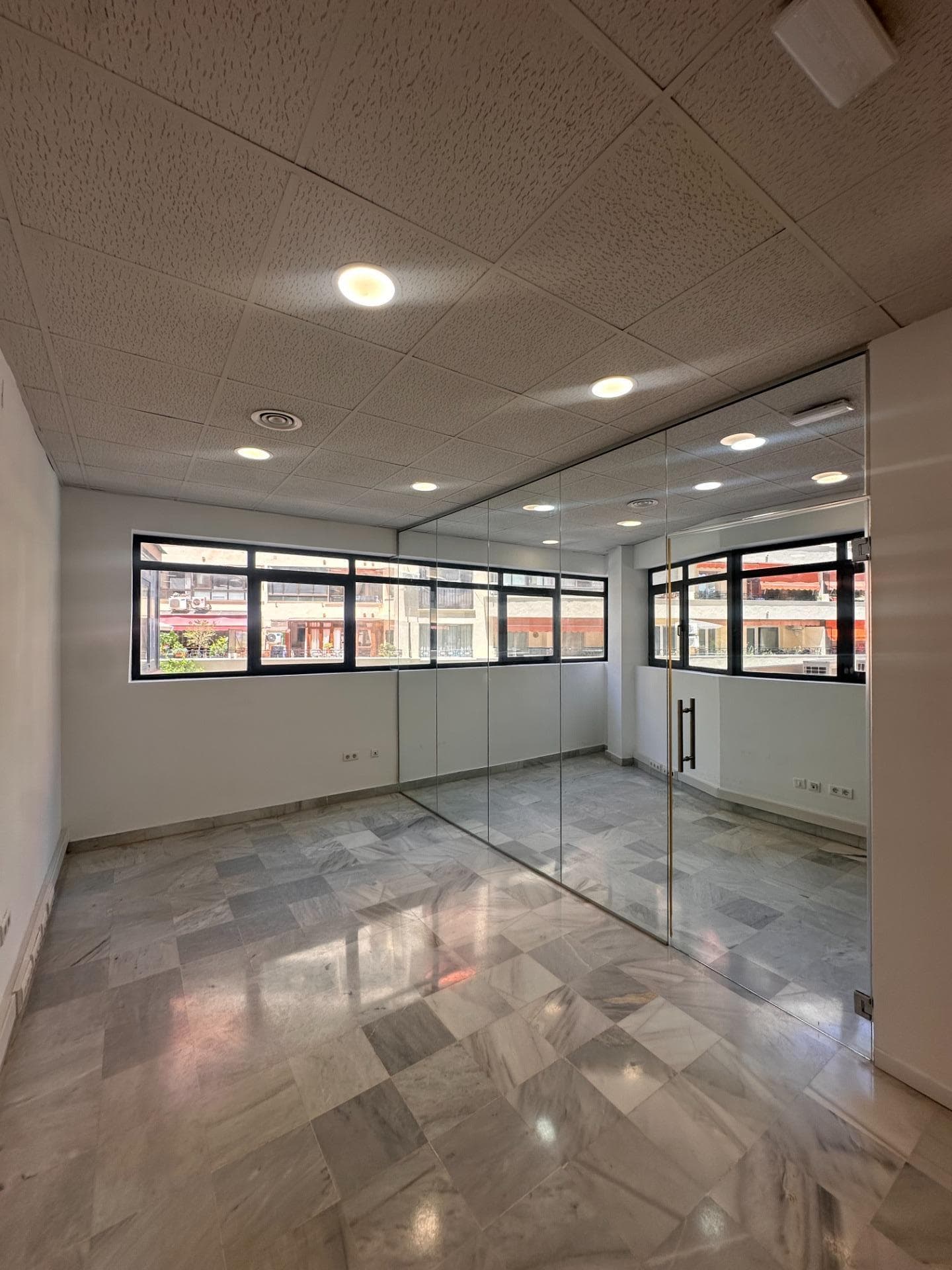 This bright and modern 78 m² office space is perfectly situated on the first floor of the prestigious Edificio Parquesol, right in the heart of Marbella center. The property features a clean, minimalist design with polished white marble flooring, elegant accent wallpaper, and large windows that flood the rooms with natural light while offering urban views. Complete with a stylish private restroom and a functional independent layout, it provides an ideal setting for law firms, medical consultations, or creative studios. Located on Avenida Nabeul, the office boasts exceptional accessibility with an public underground parking garage right within the building, making it highly convenient for both staff and clients. Surrounded by bustling commercial and financial hubs, this property represents a premium business address and an outstanding investment opportunity in Marbella's most sought-after commercial district.
