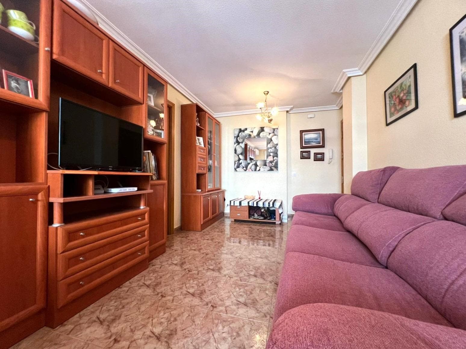 Charming 2 bedroom flat close to all amenities in Torrevieja. Walking through the door of this charming two-bedroom flat, you can feel a cosy and well-kept atmosphere. Located in a quiet and well-maintained building, this property offers the perfect balance of functionality and comfort. The living room is spacious and is connected to a pleasant balcony, ideal for enjoying a moment of rest in the open air, reading a book or sharing a quiet dinner. The kitchen, independent and fully equipped, offers everything you need for day-to-day living, with enough space to organise it according to your needs. The two bedrooms stand out for their spaciousness, offering more than enough space to create comfortable and functional spaces. The bathroom, as well, is in good condition and equipped with everything you need for day-to-day living, with a practical layout that makes it easy to use and store. The flat is located in a consolidated neighbourhood, with all services within easy reach: supermarkets, schools, pharmacies, public transport, cafés and green areas. An ideal option both for year-round living and for enjoying a second home near the sea, in a lively area with all amenities. LOCATION: Torrevieja is in the province of Alicante (Costa Blanca). It is famous for its Mediterranean climate and its coast. We cannot forget its promenades where we can find some restaurants along the fine sandy beaches. It also has many excellent beaches such as Playa de los Náufragos (2 km away), Playa de los Locos (2 km away) and Playa de la Mata (4 km away). Therefore, it is considered a remarkable tourist town where the environment takes an important place as an important tourist attraction. In addition, we can find many shopping centres (Habaneras, La Zenia Boulevard), golf courses, sport centres, hospitals (such as Hospital Universitario de Torrevieja) and airports such as Alicante Airport (35 km away) and Region of Murcia International Airport (43 km away). DISTANCE TO THE SEA: 500m COMUNITY: 272 €. IBI: 370 €. Should you have any question do not hesitate to contact us!
