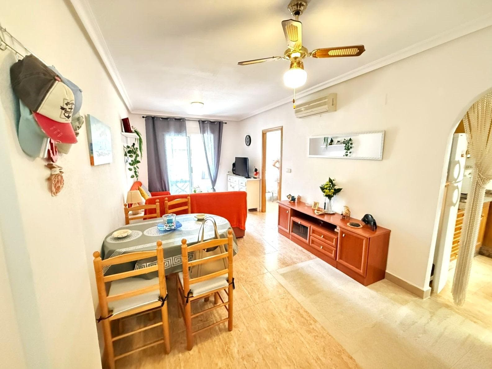 Beautiful 2 bedroom flat 250 metres from the beach in Torrevieja Upon entering this flat, the first thing that strikes you is the natural light that floods every corner. Its orientation turns the living room into a warm and luminous space throughout the day, ideal to enjoy moments of relaxation or to share with friends. The property has two bedrooms. The master bedroom offers a cosy atmosphere, with a built-in wardrobe that provides comfort. The second bedroom, equally luminous, is ideal as a guest room, office or children's room. The fully equipped kitchen is perfectly integrated, offering a practical and pleasant space. 2 bathrooms add comfort to life. But undoubtedly, one of the main attractions of this flat is its surroundings. It is only 250 metres from Los Locos beach. There are plenty of restaurants, cafes and supermarkets nearby. LOCATION: Torrevieja is in the province of Alicante (Costa Blanca). It is famous for its Mediterranean climate and its coast. We cannot forget its promenades where we can find some restaurants along the fine sandy beaches. It also has many excellent beaches such as Playa de los Náufragos (2 km away), Playa de los Locos (2 km away) and Playa de la Mata (4 km away). Therefore, it is considered a remarkable tourist town where the environment takes an important place as an important tourist attraction. In addition, we can find many shopping centres (Habaneras, La Zenia Boulevard), golf courses, sport centres, hospitals (such as Hospital Universitario de Torrevieja) and airports such as Alicante Airport (35 km away) and Region of Murcia International Airport (43 km away). DISTANCE TO THE SEA: 250 m COMUNITY: 360 €. IBI: 220 €. Should you have any question do not hesitate to contact us!