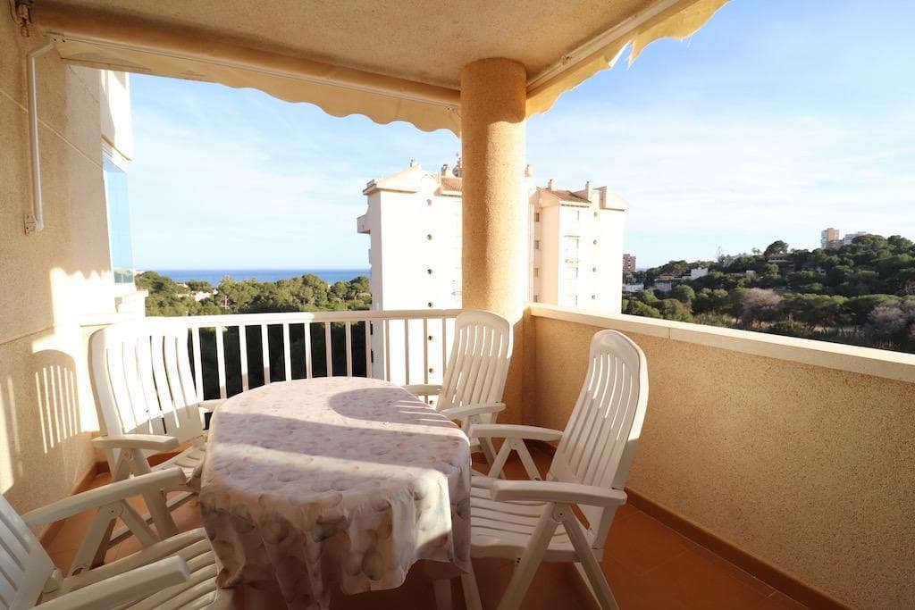 Only 300m from the beach in Pinar de Campoamor. Spacious apartment on 7th floor with sea and pine forest views and south facing.. . 99 m2 with 3 bedrooms, 2 bathrooms, spacious and independent kitchen with utility room, living-dining room with large terrace, panoramic views and south facing. . . It has numbered parking. In a beautiful urbanization with large green areas with communal swimming pool, tennis, paddle tennis, and children's play area.