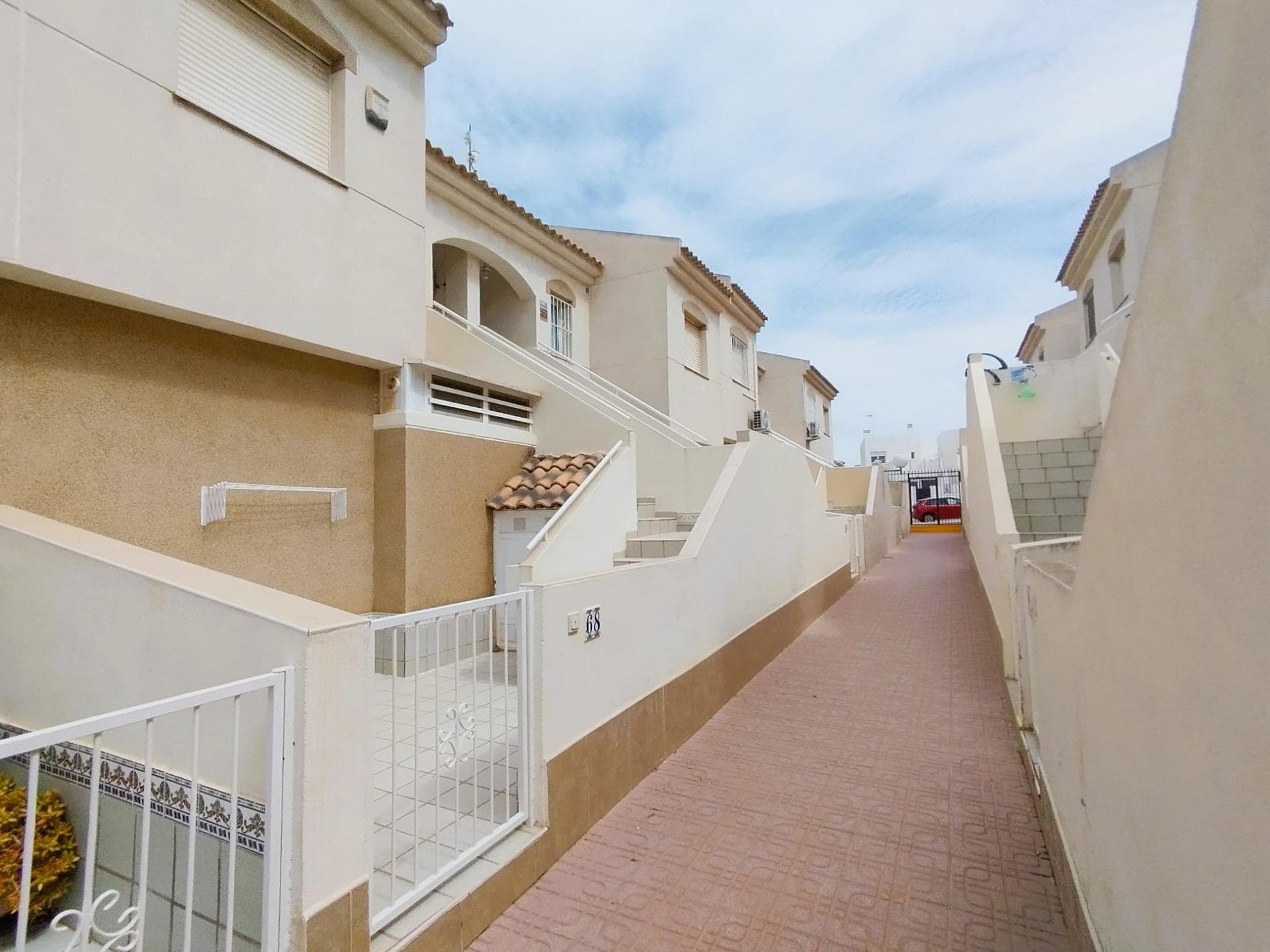 We present this charming top-floor bungalow, located in Aguas Nuevas, Torrevieja. With an excellent east-west orientation, this property stands out for its brightness throughout the day.. . The property has 2 spacious double bedrooms, 1 full bathroom and an open-plan kitchen leading to the living-dining room. The living room opens onto the terrace with views of the communal swimming pool. On the ground floor, the property also has a private patio with a storage room.. . Located in a quiet, well-maintained gated community with a beautiful communal swimming pool. Situated in one of the best areas of Torrevieja, with supermarkets, shops, bars, restaurants and the municipal sports centre within walking distance. The property also enjoys easy access to the motorway and is only a 5-minute drive from the beach and Torrevieja's main shopping centre.. . In addition, there is ample parking space in the area, adding convenience to this excellent opportunity.. . A property ready to move into, ideal as an investment and/or holiday home!