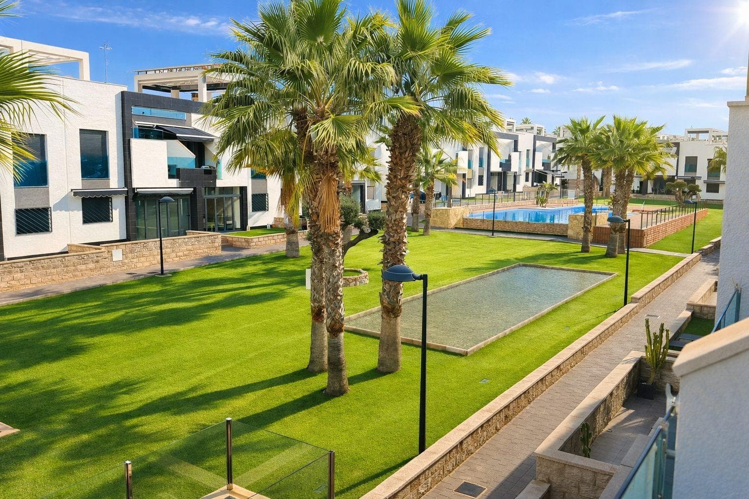Exclusive furnished penthouse in the prestigious Oasis Beach 7 residence, Torrevieja. A modern 66 m2 property designed for comfort, ideal as a high-yield investment or holiday home.. . Layout: 2 bedrooms (one en-suite), 2 full bathrooms, and a bright living room with an open-plan kitchen.. . Outdoor Spaces: Terrace overlooking the pool and a spectacular 58 m2 private solarium.. . Features: Sold fully furnished and equipped (appliances, AC, motorized shutters, and LED lighting). Includes underground parking.. . Luxury Complex: Gated community with extensive green areas and a resort-style pool.. . Location: Just 1,500 m from the beach and 5 minutes from Zenia Boulevard. Ready to move in!