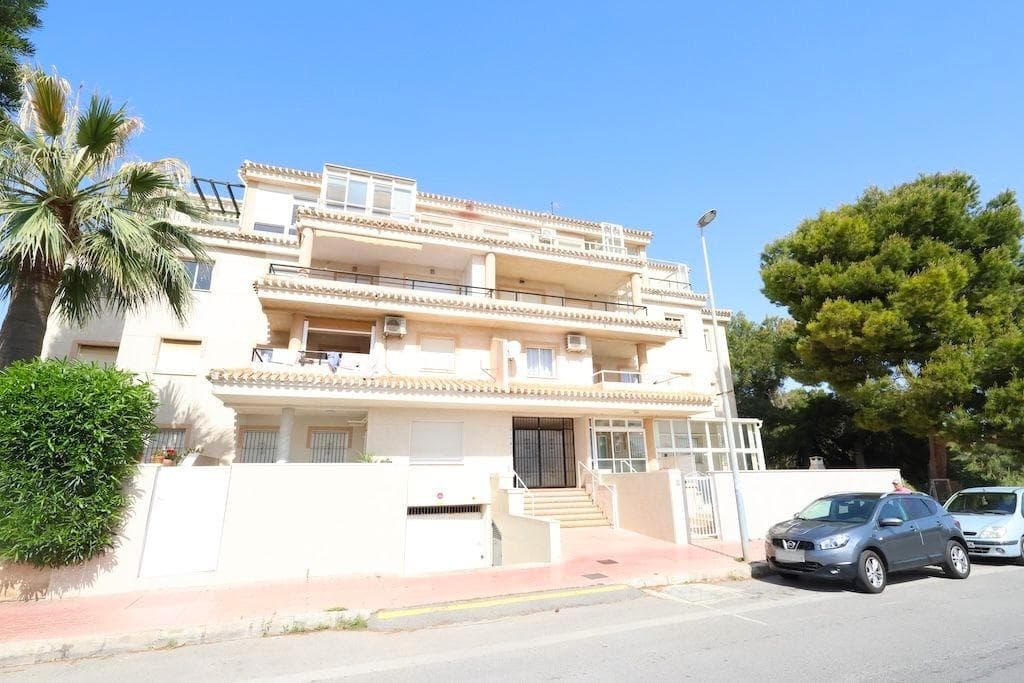 A lovely 75 m2 flat with a 6 m2 terrace and unobstructed views of a pine-tree-lined area, ideal for enjoying peace and quiet and plenty of natural light. . . The property comprises 2 double bedrooms with fitted wardrobes, 1 spacious bathroom and a large living-dining room with an open-plan kitchen and access to the terrace. It also features a utility room/storage room. . . Sold furnished and in perfect condition, ready to move into or generate income from day one.. . There is currently no lift, but a contribution has been paid to install one.. . Located in a gated community with a communal swimming pool and parking areas, in Orihuela Costa. Its location is particularly convenient, situated between Playa Flamenca, La Zenia and La Florida, about a 10-minute walk from the sea and the Zenia Boulevard shopping centre, with all necessary amenities nearby.. . Contact us to view this apartment, ideal for living in, as a second home or as an investment.