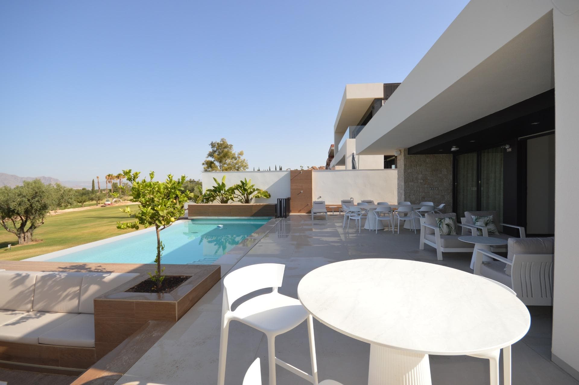 5-bedroom villa with large semi-basement on the frontline of the golf course for sale in Algorfa. A Modern Masterpiece in the Heart of the Costa Blanca Experience the finest in Mediterranean living with this newly 2024 built, frontline golf villa set within the exclusive La Finca Golf Resort in Algorfa.  Designed with impeccable attention to detail, this exceptional home blends elegant contemporary design with high-end functionality, creating the perfect balance between style, space, and serenity. Key Features: Prime Frontline Golf Position – Private & direct views over the fairways of La Finca Golf Course 5 Spacious Double Bedrooms & 4 Bathrooms Self-Contained 3-Bedroom Guest Apartment with private kitchen and independent access Private Lift – Connecting all levels for easy, step-free access Wheelchair-Friendly Design – Wide hallways, generous doorways, and barrier-free living areas Designer Kitchen with top-of-the-line Siemens appliances Underfloor Heating Throughout Smart Home Automation System Private Infinity Swimming Pool with electric pool cover and chill-out zone Fully Landscaped Mediterranean Garden Underground Garage for 2 Vehicles High-Speed Internet – Indoors & Outdoors Advanced Alarm & Video-Controlled Security System Layout & Design: This elegant villa is distributed over two floors: Main Floor: Open-plan living area, premium kitchen, master suite with walk-in wardrobe, additional bedrooms, and access to poolside terrace Ground Floor: Separate 3-bedroom apartment, ideal for guests, extended family, or luxury rentals Garage: Underground parking for 2 cars, laundry area, and storage Crafted with modern architecture and floor-to-ceiling windows, the home captures natural light and seamlessly connects indoor and outdoor living.  The Location – La Finca Golf Resort, Algorfa: Located near the charming town of Algorfa, in the heart of the Vega Baja, this villa offers an exceptional lifestyle surrounded by nature, golf, and Mediterranean tradition. The area is renowned for its citrus groves, relaxed atmosphere, and close proximity to the coast. On-Site Amenities: Restaurants, bars, supermarket, pharmacy, and more Golf: Championship 18-hole La Finca Golf Course Beaches: Just 20 minutes to the sandy shores of Guardamar & Torrevieja Shopping: Close to La Zenia Boulevard and Habaneras Shopping Centres Airports: Alicante (40 mins), Murcia International (55 mins) A Lifestyle of Comfort, Elegance & Tranquillity: This is more than a villa – it’s a private retreat offering luxury, privacy, and convenience in one of the Costa Blanca’s most desirable golf resorts. Whether for permanent residence, vacation home, or investment, this property is a rare opportunity to own a piece of contemporary luxury in a timeless Mediterranean setting.