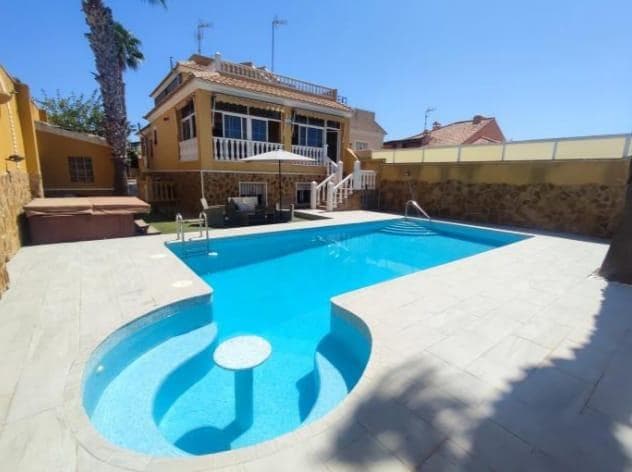 Discover your new home in Aguas Nuevas! This stunning detached house/villa, set on a 400m² plot, offers everything you need to live in luxury and comfort. With a constructed area of ​​350m² spread over three floors, this home stands out for its design and functionality. On the ground floor, you will find a spacious living room perfect for family gatherings, a fully equipped independent kitchen, two cosy bedrooms and two full bathrooms. In addition, it has two large terraces, one of them overlooking the private pool and jacuzzi, ideal for enjoying the Mediterranean climate. The first floor houses a 30m² master bedroom with a dressing room and access to a large terrace, providing an intimate and relaxing space. The private solarium offers unobstructed views, perfect for quiet moments. Floor -1 is a true oasis of entertainment with a 60m² bar equipped with a bar, billiards, table football and a film projector. In addition, this floor has a second independent home with three bedrooms and two full bathrooms, ideal for guests or family. The house is fully furnished and equipped with high quality materials, including wooden floors and an elegant marble staircase. Ducted air conditioning and two pellet fireplaces ensure comfort at any time of the year. Located close to all local amenities and just 2 km from La Mata beach, this property is perfect for those looking for a balance between tranquility and accessibility. Don't miss the opportunity to live in this real estate gem. Contact us for more information and to schedule a visit!