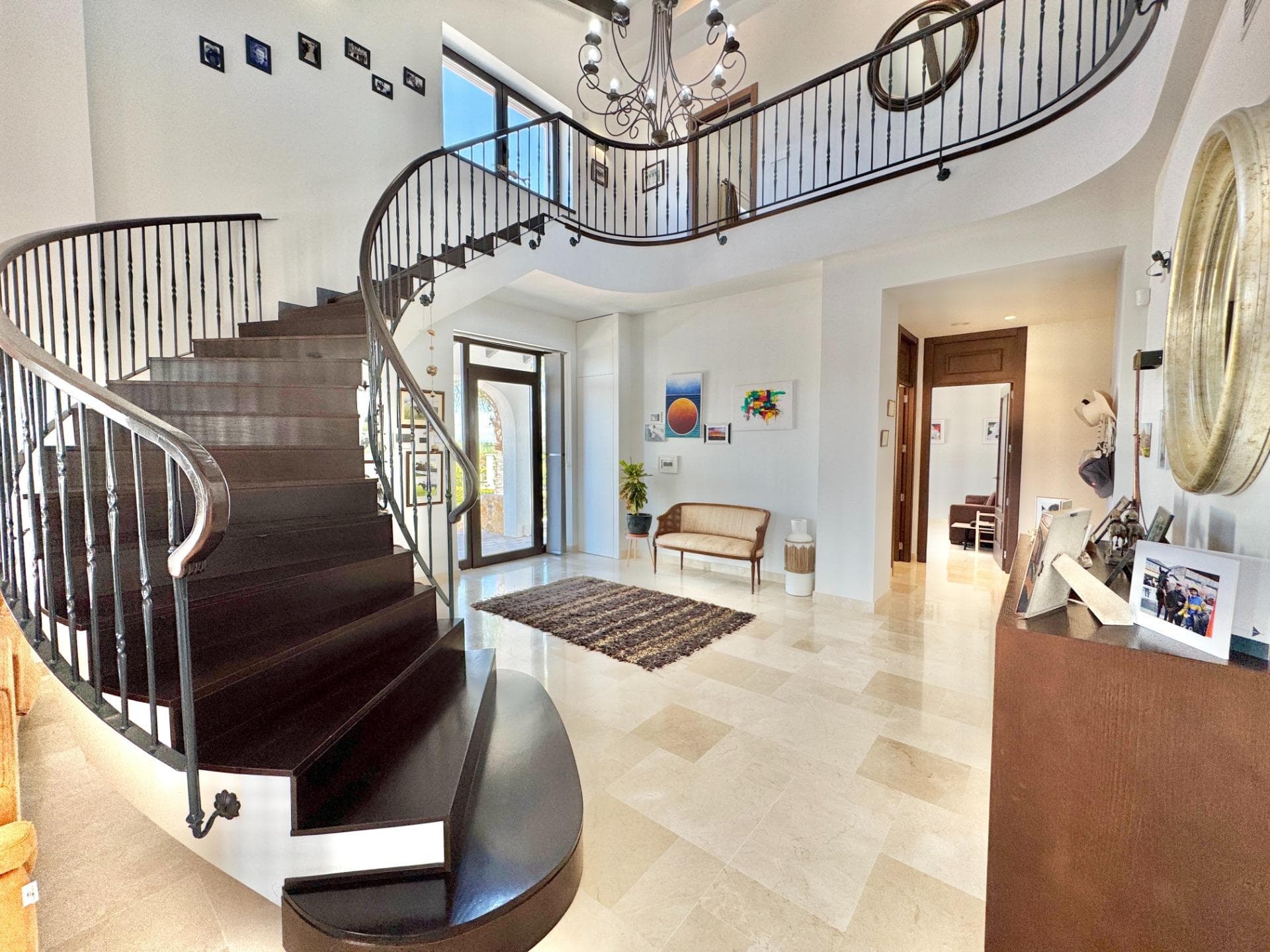 This exceptional eco-efficient villa offers 4/5 bedrooms (2 master en-suite) and an additional family bathroom. With 425 m² of built space on a 21,000 m² plot, it combines sustainable design with high-end living. Surrounded by a 5,000 m² landscaped garden with electronic gate, the remaining 16,000 m² is suitable for optional arable use. A 12 x 6 m saltwater pool with motorised cover adds a touch of luxury. The property comes with a valid habitation certificate and all licences in place. Constructed to Passive House Standard, this villa sets a benchmark in energy efficiency and environmental responsibility. It combines sleek, contemporary architecture with traditional Spanish charm, delivering year-round thermal comfort through airtight construction, advanced insulation, and mechanical ventilation with heat and cooling recovery. The home stays cool in summer and warm in winter without the need for conventional heating or air conditioning. The expansive open-plan layout features high ceilings and connects the kitchen, dining, and lounge areas, flowing naturally from the entrance hallway. These bright and inviting living spaces feature a sweeping staircase that leads to the first floor, where you'll find Master Bedroom 1 and Bedroom 5/Office. The ground floor includes Master Bedroom 2, Bedrooms 3 and 4, and a spacious family bathroom. The kitchen, Bedroom 4, and Master Bedroom 2 all offer direct access to a private courtyard. The home includes two generous master suites with private en-suite bathrooms and walk-in wardrobes, in addition to flexible spaces for family living, guests, or working remotely. The kitchen is equipped with premium appliances and abundant natural light, offering a stylish and functional space for cooking and entertaining. The lounge area is equally luminous, with panoramic glass doors opening onto the terrace and garden, creating a seamless indoor-outdoor lifestyle. Sustainable technology is integrated throughout the property. A smart home system provides complete control over lighting, temperature, humidity, and ventilation. Mechanical ventilation with heat recovery ensures fresh, filtered air all year round. High-performance triple-glazed windows and high-grade insulation optimize energy efficiency and comfort. The entire ground floor is fully wheelchair accessible. A remotely controlled alarm and camera system offers enhanced security. The property is situated on a private and extensive plot that allows for complete privacy. The landscaped garden features mature fruit trees and a vegetable plot, with open views across agricultural land — ideal for gardening, hobby farming, or simply enjoying the natural surroundings. A 12 x 6 m saltwater swimming pool with motorised cover and optional heating adds a luxurious touch. An outdoor shower room and toilet offer additional convenience. Perfect for animal lovers, the flat terrain is ideal for pets and horses alike, with ample space for grazing or potential development of stables. The villa also includes a dedicated workshop and multiple parking options, including a carport for two vehicles. Although nestled in a quiet countryside setting, the property is just minutes from essential services such as schools, local markets, and supermarkets. Alicante International Airport is only 30 minutes away, while the stunning beaches of Guardamar and La Marina can be reached in just 15 minutes. Several prestigious golf courses are also within a short drive, completing the Mediterranean lifestyle experience. For those seeking a future-proof, environmentally responsible residence that combines sustainability with luxury, this eco-efficient villa in Dolores offers an exceptional opportunity — ideal for families, professionals working remotely, or anyone who values comfort, privacy, and a greener way of living.