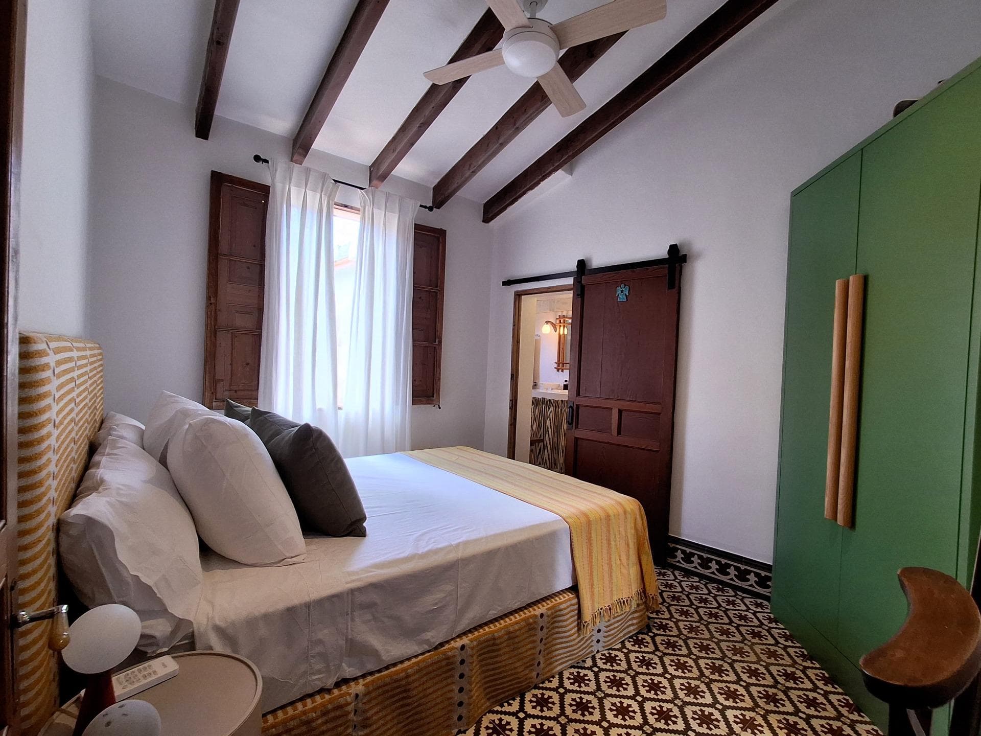 Wonderful dream house in the charming town of Capdepera.. The property has a mix of different styles, which makes it modern, cozy and very practical. This home is located in a strategic area, completely close to the town's points of interest: the shopping area, medical center, school, music school, parking, etc.... The house is renovated and very well equipped. . The property is divided into three floors: cellar, ground floor and first floor.. On the ground floor we find a bright and fantastic living room, which has direct access to the balcony with views to the outside.. On the same floor we find a pantry that can serve as a closet or as a small storage room. There is also a dining room and next to it is the kitchen.. The kitchen is designer and has lots of light, space and furniture for storing utensils and kitchenware. It is also fully equipped with stainless steel appliances and in the center it has a beautiful island to enjoy breakfast in the morning.. Following the kitchen, in the hallway under the stairs there is a small closet that serves as a gallery and in front of it we find a complete bathroom with a shower.. The soil material of this plant is microcement. The windows, blinds, doors and beams are made of wood. And they are the originals of the house.. On the first floor we find the bedrooms. Two of them are doubles and one single with an en-suite bathroom. On this same floor there is a complete double bathroom with a shower tray.. The floor material on this floor is hydraulic tile and in the hallway there is a beautiful custom-made closet to store bed linen.. From this floor, climbing some stairs you can access a small terrace, from which we can enjoy spectacular panoramic views of Capdepera. There is also another terrace with a stoneware floor, ideal for use as a solarium or chill out area.. All bedrooms and the living room have air conditioning (hot/cold).. Important information:. Furniture is not included.. Purchase taxes, notary fees and property registration are not included in the price.. We are also builders and we offer all kinds of advice for possible renovations.. Don't miss this unique opportunity to acquire a renovated house ready to move into in Capdepera! Come and discover your new home today.