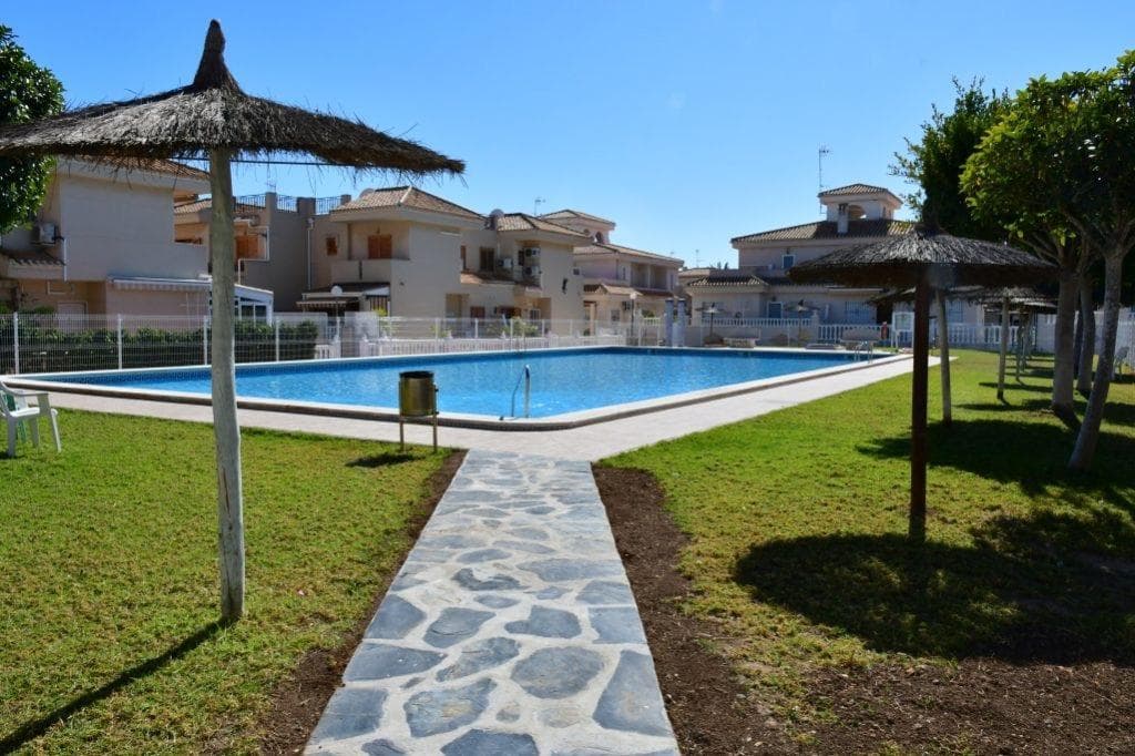 Discover this charming ground floor apartment located in the sought-after area of ​​La Zenia, Orihuela Costa. With an attractive price of €185,000 and a constructed area of ​​65 m², this property is ideal for those seeking comfort and quality of life. It features two spacious double bedrooms that offer abundant natural light thanks to their all-exterior design. The property is situated just 1000 meters from the Mediterranean Sea, providing quick and easy access to the beautiful local beaches. It also boasts terraces perfect for enjoying the warm Spanish climate outdoors. For added convenience, you can take advantage of the communal swimming pool located within a well-maintained gated community that ensures security with its perimeter fencing. Abundant amenities are nearby: you'll find buses providing easy access to various connections and major shopping centers, as well as excellent schools in the surrounding area, guaranteeing both peace of mind and daily convenience. With all these unique features, this is your perfect opportunity if you're looking for a holiday home or permanent residence by the sea.