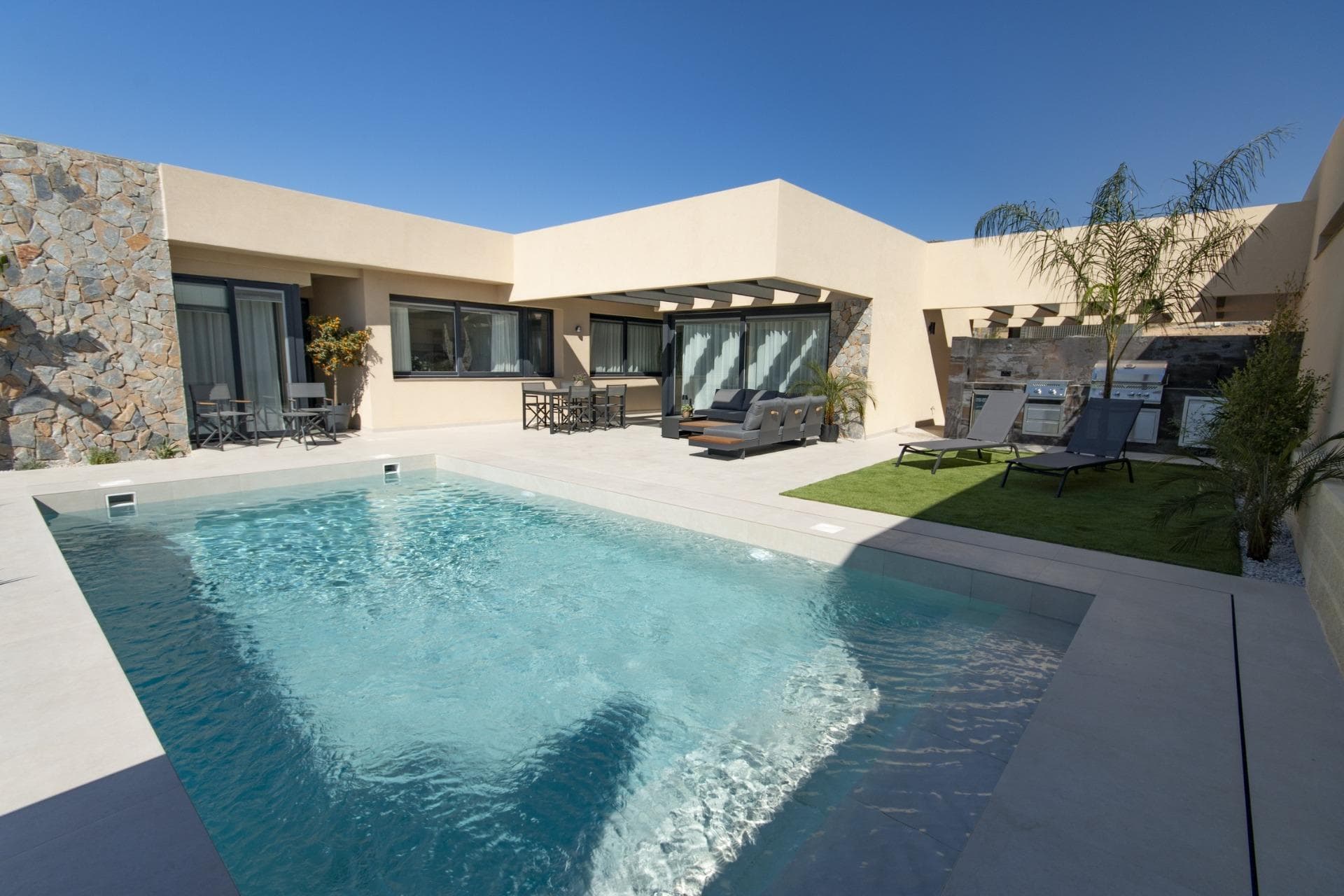 NEW BUILD VILLAS IN ALTOANA GOLF RESORT, MURCIA

 New Build residential of beautiful villas in Altaona Golf resort, Murcia.

 Villa has 3 bedrooms, 2 bathrooms, open plan kitchen with the lounge area abd direct access to the garden with private pool and parking space. 

 Villas are designed specifically to provide endless views of the golf course, lakes and distant countryside, from inside or out.

 South-facing gardens and terraces ensure that you can enjoy the warm winter sun, and generous glass windows provide additional views over the region from the comfort of the interior.

 Villas have been crafted to maximize comfort, privacy and efficiency. indigenous plants have been placed on the rooftops to create the feeling of another natural space

 Located in a privileged environment where we can live quietly, in contact with nature and the mountains, we achieve quality of life, fresh air and open spaces.

 Exclusive New Build residential located in Altaona Golf just 15 minutes by car from the centre of Murcia capital and 15 minutes from the beaches you can enjoy the tranquillity and security offered by the Golf Course that has 18 holes and the comfort to live close to all services.

 Included in the spacious resort are all kinds of services such as a shopping center, tennis, paddle and basketball courts. The front gate is always staffed, making Altaona a place where children can safely play outside. In total, some 500 homes are added to make up the Altaona resort, spread over an area of ​​3.6 million m2.

 Here are a few local highlights:
 • Murcia center: 15 minutes.
 • Beach: 20 minutes.
 • Corvera Airport: 20 minutes.
 • Alicante Airport: 45 minutes.
 • Shopping Center (La Alberca): 8 minutes.
 • Hospital: 10 minutes