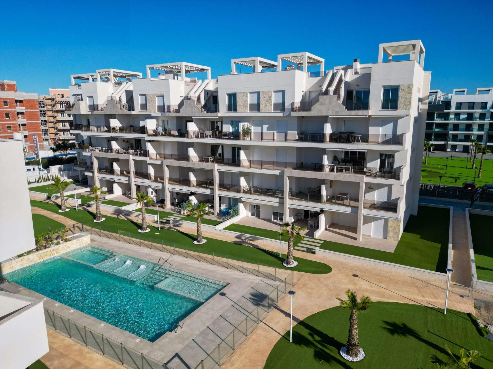 NEW BUILD RESIDENTIAL IN EL RASO, GUARDAMAR DEL SEGURA

New Build private residential complex of apartments in El Raso, Guardamar del Segura. 

Complex consisting of 135 homes with 2 or 3 bedrooms in blocks of 3 or 5 floors plus solarium, designed in a minimalist way and with high quality standards, its modern architecture harmonises with our large open spaces, nature and swimming pools, offering a unique and peaceful atmosphere. 

Beautiful residential complexes, including a glassed-in GYM-Spa area with views of green areas, swimming pools and from its terrace overlooking the salt lagoon of La Mata, paddle tennis court, etc. 

Furniture pack included in the price.
Parking space included in the price.

Development is located on a unique and unrepeatable plot, bordering the natural landscape of the salt lagoon, enjoy its biodiversity and unique environment, in El Raso de Guardamar del Segura, with all kinds of services and amenities and close to the best beaches of the Mediterranean. 

At the same time, thanks to the proximity of El Moncayo beach, you will be able to go for a bike ride and enjoy the best climate of the Costa Blanca. 

Additionally and thanks to the five levels of some of the blocks that make up the residential, all of them facing south, we include in our luxury penthouses, fully equipped kitchen on the solarium, outdoor shower (hot/cold water), and jacuzzi area, to complete the unique experience of living in front of a unique and unrepeatable natural environment. 

El Raso is a part of Guardamar del Segura.

Guardamar del Segura is a town located on the Costa Blanca South. With its 11 kilometres of natural beach and its large pine forest.

Guardamar del Segura has a large port with activities throughout the year, it has a large sports centre with paddle tennis, tennis, soccer and a large heated swimming pool that works all year round. It also has a library where there is free wifi and computers.

Guardamar del Segura is only 20km away from the Alicante - Elche (El Altet) airport, where there are many flights every day with connections to the main European cities, due to the demand for tourists on the Costa Blanca.