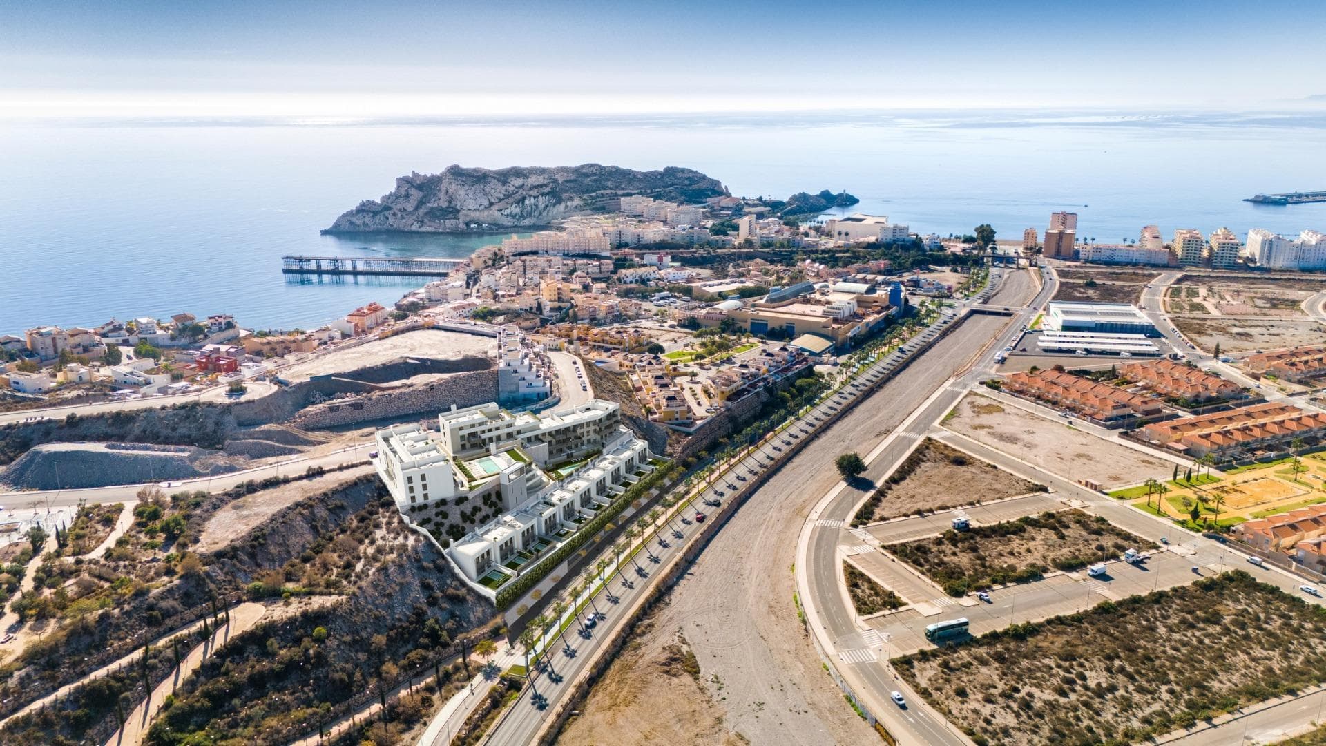 NEW BUILD RESIDENTIAL COMPLEX IN AGUILAS

New Build exclusive residential complex of apartments and villas in Aguilas.

New Build complex consist of 36 apartments with 3 and 2 bedrooms distributed in 4 modern blocks, equipped with 2 communal swimming pools and community garage with parking space and storage room for each property; and 10 elegant villas of 4 bedrooms and 3 bathrooms, each one with its own private pool. 

This residential complex has been designed with excellence in mind, offering spacious terraces on the ground and first floors and solariums on the upper floors, where the view of the horizon becomes a canvas of experiences.
The houses have fully equipped kitchens and bathrooms and pre-installation for ducted air conditioning.

Complex located 800 metres from the sea, next to a Shopping Centre.

Aguilas located in exceptional area on Costa Cálida at only 50 minutes from the new Murcia or Almeria airport and 1h30 from Alicante airport.

Aguilas it is a small city with many amenities, a long beach to walk and relax in the sun. Is a perfect enclave for diving, water sports, hiking and golf.

It has 28 kilometers of coastline in which there are 35 beaches with different types of sand thickness located in different landscapes, from coves and virgin beaches in natural settings to the urban beaches of the town of Aguilas.
Its warm desert climate is present all year round with an annual average of 22º with mild temperatures in winter and very hot in summer.