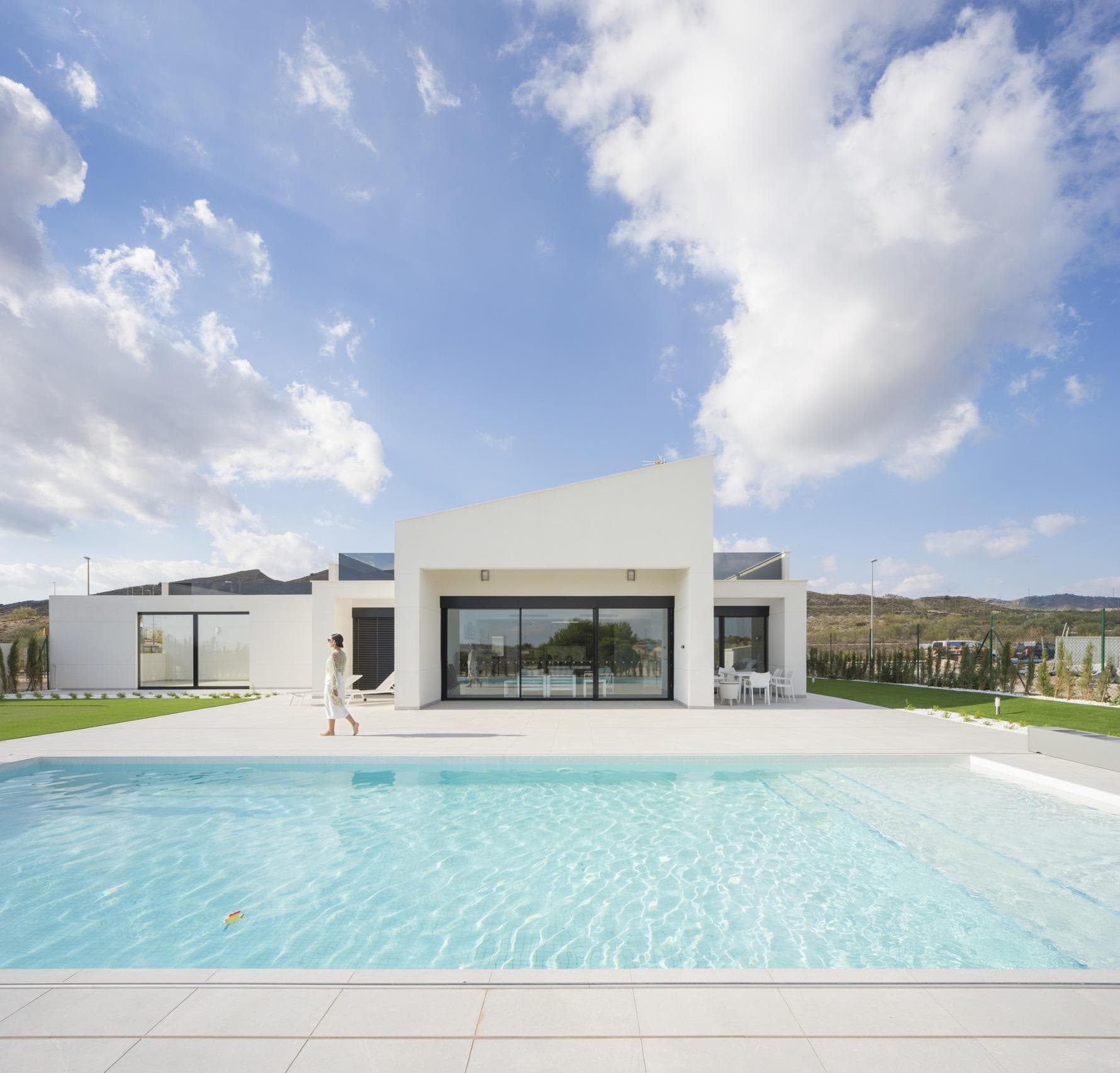NEW BUILD VILLAS IN ALTAONA GOLF RESORT, MURCIA

 New Build residential of beautiful villas in Altaona Golf resort, Murcia.

 Located in a privileged environment where we can live quietly, in contact with nature and the mountains, we achieve quality of life, fresh air and open spaces.

 New Build Modern villa distributed in one floor. 
 4 bedrooms, 4 bathroom, open plan kitchen with bright living room with large windows and direct access to the pool and garden, solarium and garage.

 Exclusive New Build residential located in Altaona Golf just 15 minutes by car from the center of Murcia capital and 20 minutes from the beaches you can enjoy the tranquility and security offered by the Golf Course that has 18 holes and the comfort to live close to all services.

 Murcias airport Corvera only 15 minutes drive away.