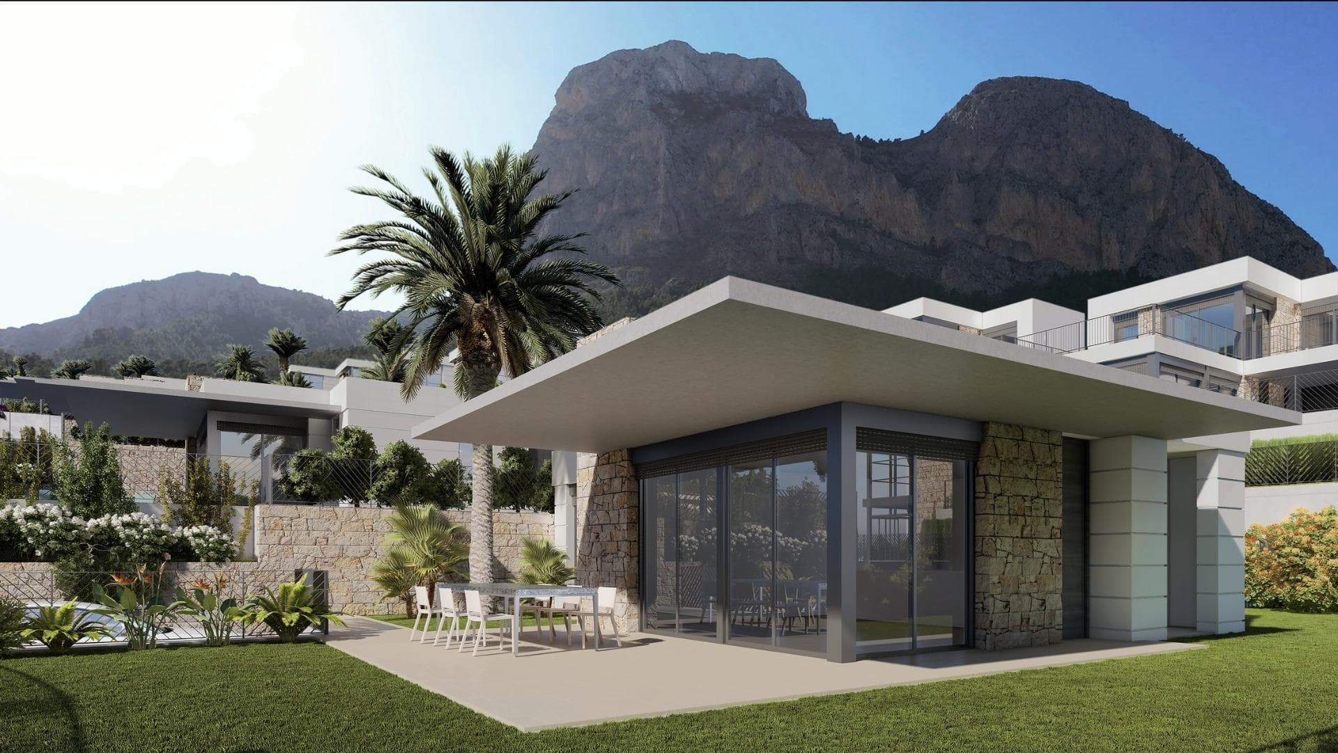 New Construction Villas in Polop, Alicante

Modern Living Surrounded by Nature
Discover this exclusive residential development of newly built villas in Polop, a charming inland village located in the province of Alicante. Just 10 km from Benidorm’s lively beaches and nightlife and close to the picturesque town of Altea, these homes offer an unbeatable combination of modern comfort and natural beauty.

A Residential Development Tailored to Your Needs
The project consists of 65 independent villas available in different layouts to suit your needs and budget. Choose between 3 or 4-bedroom homes, with options for single or two-story designs. Many of the properties are designed on a single level, providing enhanced accessibility and a comfortable living experience without the need for stairs.

Each home is thoughtfully designed with spacious terraces, private gardens, and interior/exterior spaces where you can enjoy the Mediterranean climate. Optional private pools are also available to add an extra touch of luxury to your new home.

Prime Location with Easy Access to Key Destinations
Located in a peaceful natural setting, the development is ideal for those seeking tranquility without sacrificing convenience. The surrounding area offers access to key points of interest:

Benidorm Beaches: 10 km (15-minute drive)
Playa del Albir: 12 km (20 minutes), renowned for its pristine waters and scenic promenade
Alicante Airport: 60 km (45 minutes)
Villaitana Golf Course: 12 km (15 minutes)
La Marina Shopping Center: 10 km (15 minutes)

Premium Features for Modern Comfort
Each villa is equipped with high-quality finishes and state-of-the-art systems, ensuring maximum comfort, security, and sustainability:
Double-glazed PVC windows with thermal and solar insulation
Reinforced front doors for enhanced security
Fully equipped kitchens with induction hob, oven, extractor hood, and stainless-steel sink
Modern bathrooms with stylish porcelain sinks and fittings
Pre-installed ducted air conditioning with heat pump
Hot water supplied via aerothermal systems for energy efficiency
Gated community with perimeter surveillance cameras

Polop: The Perfect Blend of History and Nature
Polop de la Marina is a historic town surrounded by stunning landscapes. Its charming old town, the Gabriel Miró House-Museum, and various hiking trails make it a sought-after destination for nature and history enthusiasts.

Experience Coastal and Countryside Living
Embrace a new lifestyle in these carefully designed homes, where comfort meets nature. Enjoy the panoramic views through large windows that frame the surrounding landscape, creating the perfect balance between indoor and outdoor living.

Don’t miss the opportunity to own your dream home in Polop! Contact us today for more information and to schedule a visit.