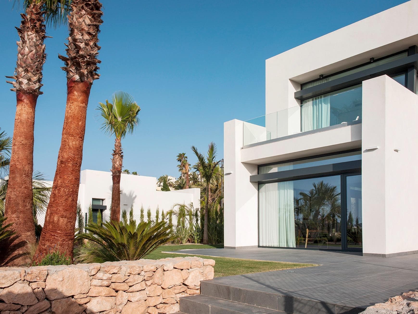 New Build Villas for Sale at La Manga Club – Luxury Living in a Prestigious Resort

Modern, Spacious Villas in a Central Location

Discover the stunning new-build villas for sale at La Manga Club, thoughtfully designed to meet the needs of modern living. These luxurious properties offer practical layouts, high-end finishes, and access to all the amenities of this world-renowned resort.

Situated in the heart of La Manga Club, this exclusive development features 29 spacious plots ranging from 500m² to 746m². Buyers can choose villas with 2, 3, or 4 bedrooms, complete with private pools, landscaped gardens, and secure parking. Whether you are looking for a holiday home or a permanent residence, these villas offer a perfect blend of comfort, style, and convenience.

Premium Features and High-Quality Finishes

Each villa is constructed to the highest standards, incorporating modern design elements and advanced technology for maximum comfort. Key features include:

High-performance aluminum carpentry with thermal bridge breaks (CORTIZO or similar).

Insulating double glazing for energy efficiency and comfort.

Home automation systems to control lighting, electricity, and electronics.

Aerothermal systems for heating, cooling, and domestic hot water.

High-efficiency ventilation with controlled mechanical systems.

Security features, including alarm systems and pre-installed video surveillance.

Exclusive Location – La Manga Club Resort

La Manga Club is one of Europe’s leading sport and leisure resorts, offering an unparalleled lifestyle in a stunning Mediterranean setting. Covering 1,400 acres (560 hectares), the resort is bordered by natural parks and unspoiled beaches, providing breathtaking surroundings and year-round sunshine.

Residents enjoy access to world-class amenities, including:

Three championship 18-hole golf courses

The Racquets Club with 28 tennis and padel courts

Fitness and spa facilities in the Grand Hyatt La Manga Club Golf &amp; Spa

Private beach access and fine dining options

FIFA-standard football pitches for sports enthusiasts

Excellent Connectivity and Nearby Attractions

La Manga Club is perfectly located with excellent transport links to major European cities:

Corvera Airport – 50 km (approx. 35 minutes by car)

Alicante Airport – 100 km (approx. 1 hour by car)

Other nearby points of interest include:

Beaches – Less than 3 km to the pristine Mediterranean coastline

Golf Courses – On-site with three championship courses

Shopping Centers – Located 10-15 km away for all your retail needs

Marinas and Ports – Accessible within 20 km for sailing and water sports lovers

The Ideal Place for Luxury Living

La Manga Club offers a vibrant and secure community ideal for families, retirees, and golf enthusiasts. Enjoy a peaceful and private lifestyle with access to first-class facilities, all while surrounded by natural beauty and modern conveniences.

Experience luxury living at its finest with these new-build villas at La Manga Club. Don’t miss this opportunity to own a home in one of Europe’s most prestigious resorts.

Contact us now for more details or to schedule a visit.