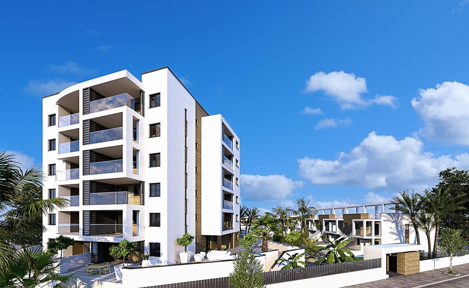 Apartamentos y Bungalows de Obra Nueva en Mil Palmeras

Moderno complejo residencial en una ubicación privilegiada
Descubra un nuevo e impresionante complejo residencial en la encantadora zona costera de Mil Palmeras, que ofrece una selección de apartamentos y bungalows de alta calidad diseñados para satisfacer los estándares de vida modernos. Situado a sólo 600 metros de las playas de Mil Palmeras, este complejo combina confort, estilo y comodidad.

Amplios y elegantes apartamentos y bungalows
Elija entre apartamentos de 2 o 3 dormitorios, cada uno con 2 cuartos de baño y amplias terrazas. También puede optar por bungalows de 2 dormitorios y 2 baños, disponibles en planta baja con jardín privado o en planta alta con solárium exclusivo.

Acabados de alta calidad para una vida moderna
Esta promoción ofrece características y acabados excepcionales:
Carpintería exterior de PVC con rotura de puente térmico y doble acristalamiento «Climalit» de baja emisividad.
Puertas de entrada blindadas para mayor seguridad.
Baños equipados con lavabos, espejos y grifería moderna.
Armarios empotrados con iluminación interior LED, cajones y barras de colgar.
Suministro de agua caliente mediante aerotermia para una mayor eficiencia energética.
Preinstalación de aire acondicionado y calefacción por conductos en salones y dormitorios.
Servicios comunitarios exclusivos

El complejo está totalmente cerrado y cuenta con:
Preciosos jardines comunitarios.
Piscinas de agua cristalina para los residentes.
Plazas de aparcamiento subterráneo opcionales y trasteros para mayor comodidad.

Ubicación privilegiada en Mil Palmeras
Situada entre Campoamor y Torre de la Horadada, esta urbanización ofrece fácil acceso a los servicios locales, colegios, restaurantes e instalaciones deportivas abiertas todo el año. Mil Palmeras es conocida por su encantadora plaza del pueblo y su vibrante «callejón de los restaurantes», que ofrece diversas cocinas internacionales.

Para los entusiastas de la naturaleza, el Parque Natural de Lo Monte, una reserva de aves protegida, y el Parque Natural de Río Seco ofrecen lugares perfectos para practicar senderismo y relajarse.

Proximidad a los principales puntos de interés
Aeropuerto Internacional de Murcia: 40 km (aprox. 45 minutos).
Aeropuerto de Alicante: 75 km (aprox. 45 minutos).
Campos de golf más cercanos: A menos de 10 km.
Centros comerciales: A 8 km de Zenia Boulevard.
Puertos deportivos: A 5 km de Torre de la Horadada.

La casa de sus sueños le espera
No pierda la oportunidad de tener una propiedad en este excepcional complejo residencial. Tanto si busca una casa de vacaciones como una residencia permanente, esta urbanización en Mil Palmeras lo tiene todo. Póngase en contacto con nosotros hoy mismo para obtener más información o para concertar una visita.