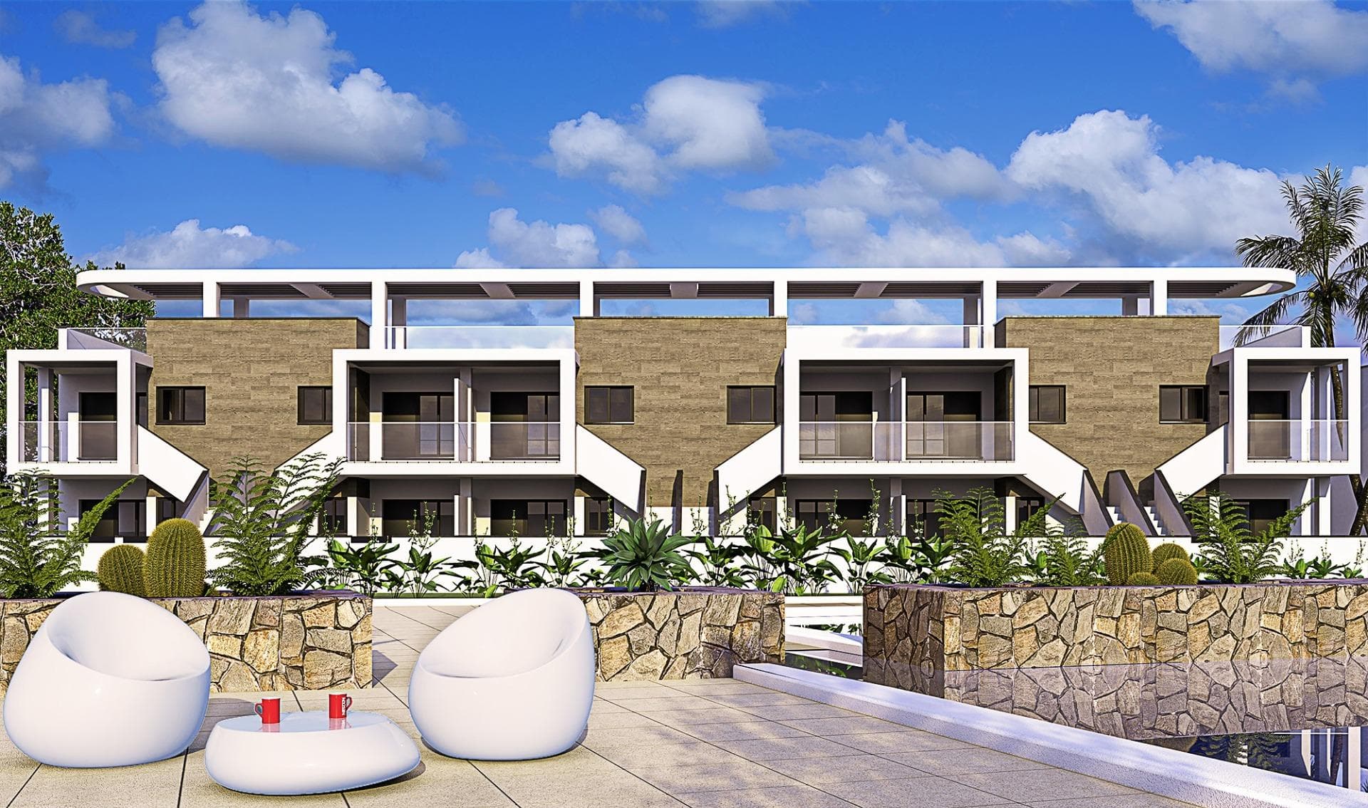 Apartamentos y Bungalows de Obra Nueva en Mil Palmeras

Moderno complejo residencial en una ubicación privilegiada
Descubra un nuevo e impresionante complejo residencial en la encantadora zona costera de Mil Palmeras, que ofrece una selección de apartamentos y bungalows de alta calidad diseñados para satisfacer los estándares de vida modernos. Situado a sólo 600 metros de las playas de Mil Palmeras, este complejo combina confort, estilo y comodidad.

Amplios y elegantes apartamentos y bungalows
Elija entre apartamentos de 2 o 3 dormitorios, cada uno con 2 cuartos de baño y amplias terrazas. También puede optar por bungalows de 2 dormitorios y 2 baños, disponibles en planta baja con jardín privado o en planta alta con solárium exclusivo.

Acabados de alta calidad para una vida moderna
Esta promoción ofrece características y acabados excepcionales:
Carpintería exterior de PVC con rotura de puente térmico y doble acristalamiento «Climalit» de baja emisividad.
Puertas de entrada blindadas para mayor seguridad.
Baños equipados con lavabos, espejos y grifería moderna.
Armarios empotrados con iluminación interior LED, cajones y barras de colgar.
Suministro de agua caliente mediante aerotermia para una mayor eficiencia energética.
Preinstalación de aire acondicionado y calefacción por conductos en salones y dormitorios.
Servicios comunitarios exclusivos

El complejo está totalmente cerrado y cuenta con:
Preciosos jardines comunitarios.
Piscinas de agua cristalina para los residentes.
Plazas de aparcamiento subterráneo opcionales y trasteros para mayor comodidad.

Ubicación privilegiada en Mil Palmeras
Situada entre Campoamor y Torre de la Horadada, esta urbanización ofrece fácil acceso a los servicios locales, colegios, restaurantes e instalaciones deportivas abiertas todo el año. Mil Palmeras es conocida por su encantadora plaza del pueblo y su vibrante «callejón de los restaurantes», que ofrece diversas cocinas internacionales.

Para los entusiastas de la naturaleza, el Parque Natural de Lo Monte, una reserva de aves protegida, y el Parque Natural de Río Seco ofrecen lugares perfectos para practicar senderismo y relajarse.

Proximidad a los principales puntos de interés
Aeropuerto Internacional de Murcia: 40 km (aprox. 45 minutos).
Aeropuerto de Alicante: 75 km (aprox. 45 minutos).
Campos de golf más cercanos: A menos de 10 km.
Centros comerciales: A 8 km de Zenia Boulevard.
Puertos deportivos: A 5 km de Torre de la Horadada.

La casa de sus sueños le espera
No pierda la oportunidad de tener una propiedad en este excepcional complejo residencial. Tanto si busca una casa de vacaciones como una residencia permanente, esta urbanización en Mil Palmeras lo tiene todo. Póngase en contacto con nosotros hoy mismo para obtener más información o para concertar una visita.