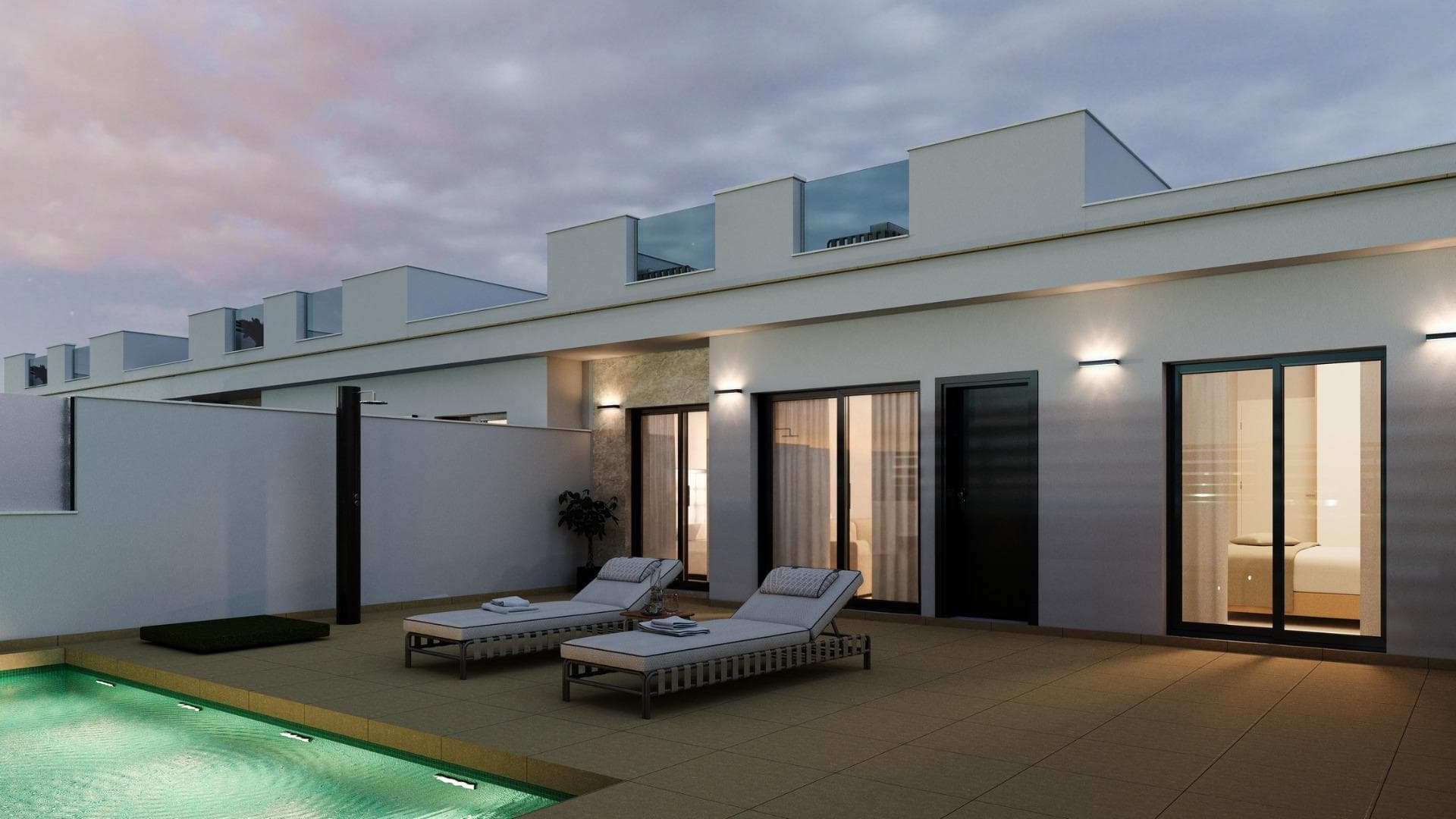 Villas Pareadas y Adosadas de Obra Nueva en Roldán, Murcia

Modernas Villas de Una Planta con Solárium y Piscina Privada
Descubra este exclusivo complejo de villas pareadas y adosadas de una sola planta en Roldán (Murcia), diseñado para ofrecer comodidad, estilo y eficiencia energética. Con opciones de 2 o 3 dormitorios y 2 baños, cada vivienda cuenta con solárium privado, piscina y aparcamiento en la parcela, ideal para disfrutar del clima mediterráneo durante todo el año.

Ubicado en un complejo cerrado con control de seguridad, este residencial garantiza privacidad y tranquilidad, a la vez que se encuentra cerca de todos los servicios esenciales, parques, instalaciones deportivas y prestigiosos campos de golf.

Características de Alta Calidad y Diseño Funcional
Cada villa ha sido construida con materiales de primera calidad para ofrecer un hogar moderno y confortable:

Carpintería exterior en PVC con rotura de puente térmico y doble acristalamiento.
Cocina totalmente equipada con muebles de gran capacidad y electrodomésticos incluidos.
Baños elegantes con muebles suspendidos, espejo con iluminación LED y mamparas en las duchas.
Puerta de entrada de seguridad para mayor tranquilidad.
Preinstalación de aire acondicionado por conductos.
3 paneles solares fotovoltaicos (1,5 kW) para mayor eficiencia energética.
Cocina de verano en el solárium con fregadero y enchufe para frigorífico.

Ubicación Estratégica en Roldán, Murcia
Roldán es un encantador pueblo tradicional con una ubicación privilegiada en la Región de Murcia. Dispone de todos los servicios esenciales, como supermercados, restaurantes, bares, clínicas de salud, farmacias, gasolineras y más.

Además, esta promoción se encuentra a pocos minutos de algunos de los mejores campos de golf de la zona, como La Torre Golf y Terrazas Golf, ofreciendo una experiencia única para los amantes de este deporte.

Distancias a puntos de interés clave:
Aeropuerto de Murcia-Corvera – 15 km (15 minutos en coche).
Playas del Mar Menor – 15 km (20 minutos en coche).
Campos de golf La Torre y Terrazas – Menos de 5 km.
Centro de Murcia – 30 km (30 minutos en coche).

Un Hogar Perfecto en el Mediterráneo
Ya sea como residencia habitual, casa de vacaciones o inversión inmobiliaria, estas villas en Roldán ofrecen la combinación perfecta de diseño moderno, ubicación privilegiada y calidad de vida.

Contáctenos hoy mismo para más información o para concertar una visita a su futura vivienda en Roldán.