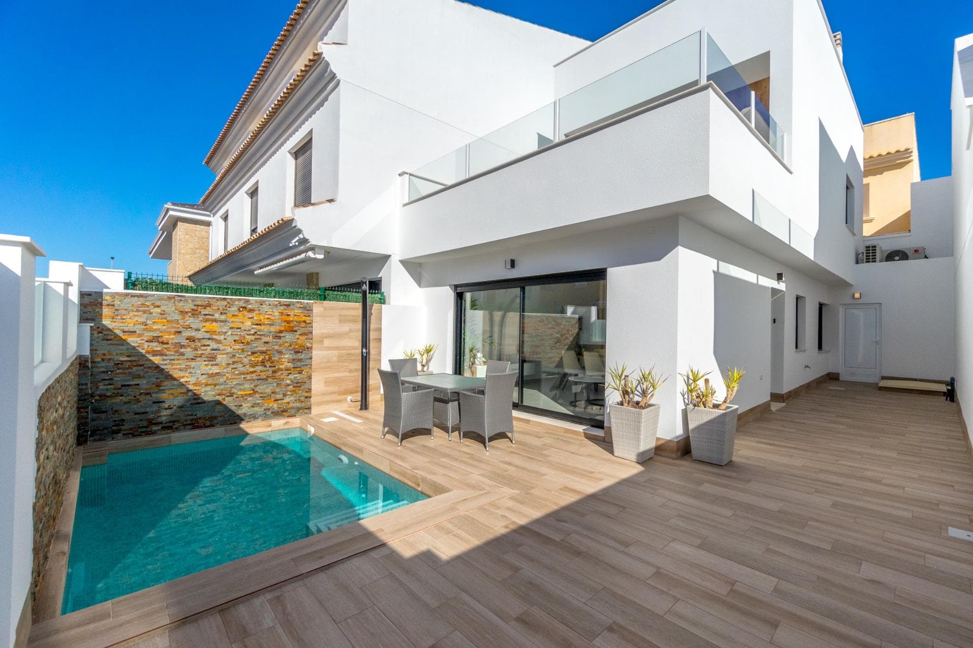 New Build Semi-Detached Villas with Private Pool in San Pedro del Pinatar&#13;&#13;Modern Homes in a Prime Location&#13;This exclusive development of 5 semi-detached villas is located in San Pedro del Pinatar, a vibrant coastal town in the Costa Cálida. Positioned near the municipal sports center, within walking distance to the town center, and just 3.5 km from the beaches of the Mar Menor and Mediterranean, these homes offer the perfect blend of comfort, convenience, and Mediterranean lifestyle.&#13;&#13;Contemporary Design and Functional Layout&#13;Each villa is distributed across two floors and designed with modern architecture, maximizing space and natural light. With 3 bedrooms and 2 bathrooms, these properties are ideal for families, holiday homes, or investment.&#13;Ground Floor: Open-plan kitchen connected to the bright living and dining area, one bedroom, one bathroom, a rear patio and direct access to the private garden with pool.&#13;First Floor: Two additional bedrooms, one bathroom, and a spacious terrace with access to the private rooftop solarium, perfect for sunbathing or entertaining.&#13;&#13;Quality Finishes and Comfort&#13;The villas are delivered with high-quality specifications and thoughtful details to ensure modern living:&#13;Fully furnished and equipped kitchen with appliances&#13;Private swimming pool and garden&#13;Rooftop solarium for year-round outdoor living&#13;Summer kitchen included&#13;Interior and exterior lighting package&#13;Closed private garage&#13;&#13;San Pedro del Pinatar - Lifestyle and Surroundings&#13;San Pedro del Pinatar is renowned for its year-round sunshine, sandy beaches, and natural landscapes such as the famous Salinas y Arenales Natural Park. The town offers all essential services, including shops, supermarkets, restaurants, health centers, and sports facilities, making it an excellent place for both permanent living and holidays.&#13;&#13;Distances to key points of interest:&#13;Beaches of the Mar Menor - 3.5 km&#13;Dos Mares Shopping Center - 5 km&#13;Lo Pagán Marina - 4 km&#13;Roda Golf - 8 km&#13;Murcia Airport (Corvera) - 35 km&#13;Alicante Airport – 75 km&#13;&#13;Secure Your New Home by the Sea&#13;These new build semi-detached villas in San Pedro del Pinatar combine modern design, high-quality finishes, and a privileged location close to the sea and all amenities.&#13;&#13;Contact us today for more information or to schedule a viewing and take the first step toward your dream Mediterranean home.&#13;