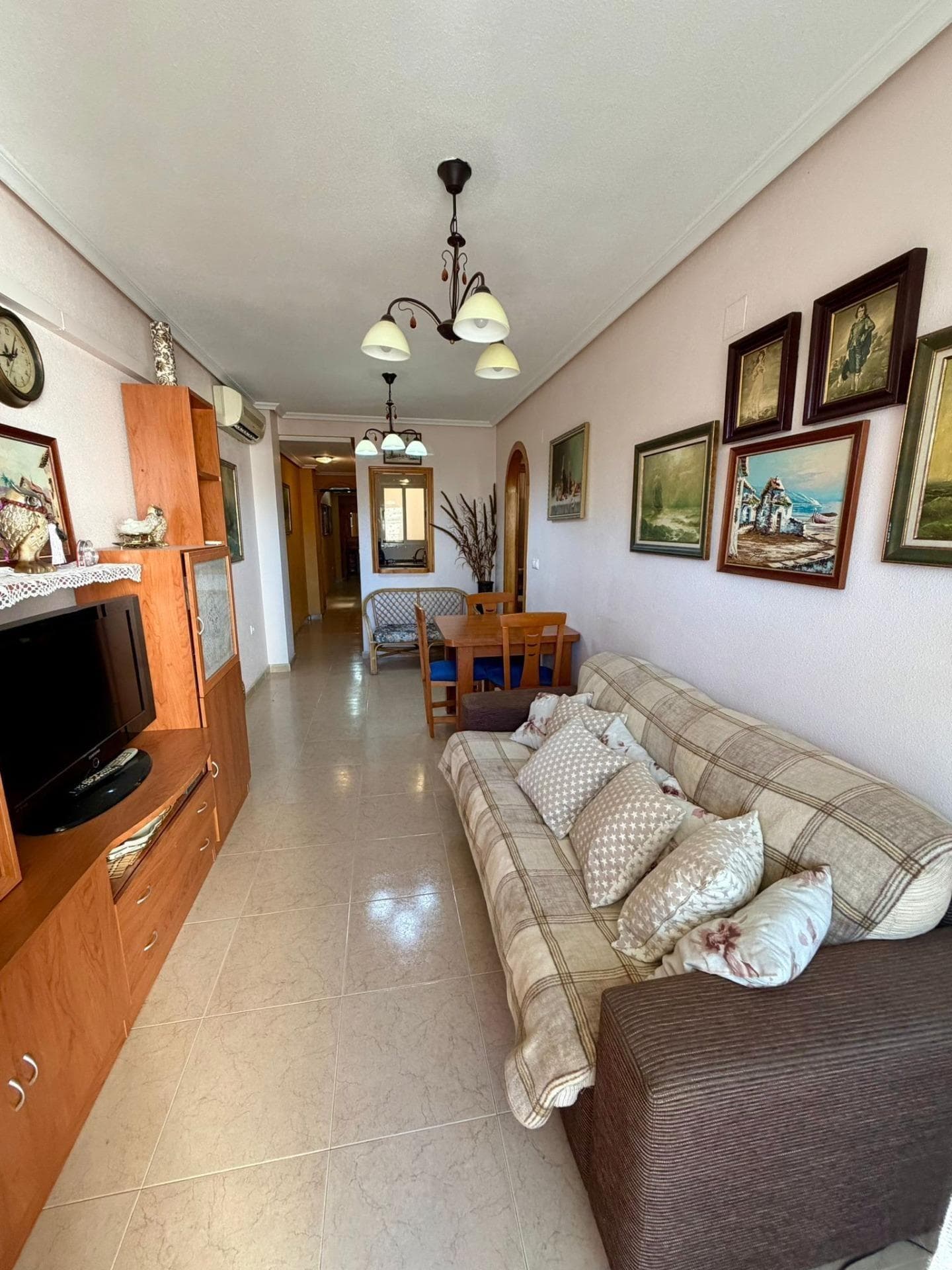 This property on the emblematic Bazán Street is not just an apartment; it is the opportunity to experience the essence of the Mediterranean with all urban conveniences within your reach. The property is distributed into a spacious living-dining room flooded with natural light. Its undeniable jewel is the large east-facing terrace, the perfect corner to enjoy sunny breakfasts or a peaceful reading session with the morning breeze. It features two double bedrooms, spacious and versatile, and a full bathroom. The fully independent and equipped kitchen stands out for its brightness, allowing you to cook in an open and comfortable environment. Living here means having everything at hand. Just 800 metres from the beach, you can enjoy the sea without needing a car. In addition, you will be only a few steps from the emblematic Constitution Church, surrounded by services, restaurants, and the vibrant life of the town centre. Don’t miss this opportunity! Homes with sunny terraces in the city centre are the first to sell. Contact us today to schedule your visit and come feel the light of this home.