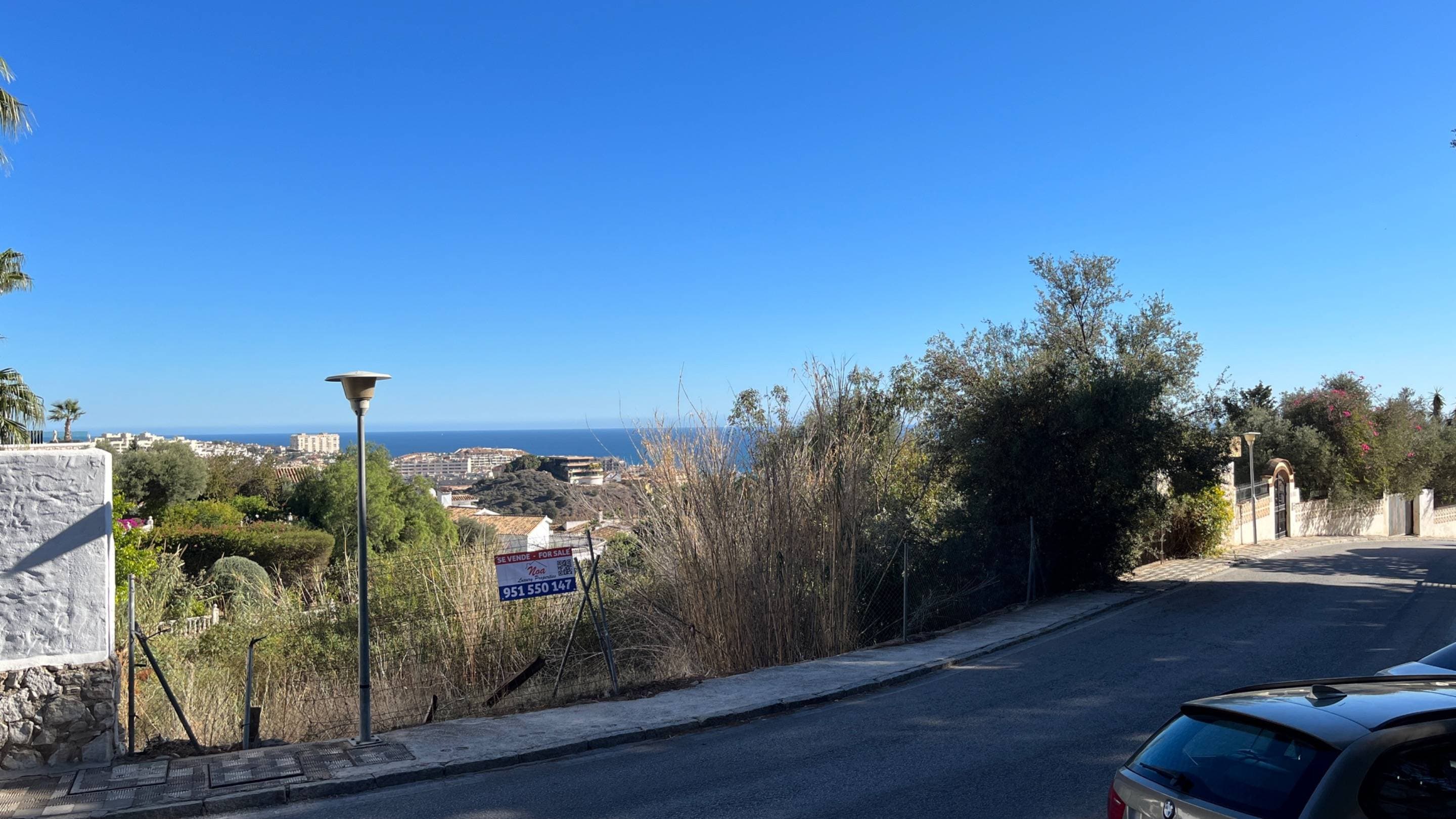 MAGNIFICENT OPPORTUNITY. We are pleased to present this interesting 1,155 m² plot located in the beautiful area of Torremuelle in Benalmádena. This plot is the ideal place for those who wish to promote the construction of a splendid house with views of the sea and the mountains. What makes this plot of land especially attractive is its prime location, generous size, stunning views and east-west orientation. The buildable area of this plot is 323 m², which provides ample opportunity to design and build the home of your dreams. The topography of this plot is unique, as it runs along a slope, which offers a truly beautiful panoramic view. Imagine enjoying impressive sunrises and sunsets from your own terrace, while contemplating the sea and the majestic mountains that surround this area. This plot has everything you need to become the perfect place to call home. In addition to its location and views, this plot is located in a consolidated area, which means that it has all the services necessary for daily life. In addition, it is conveniently located just 800 meters from the Torremuelle train station, which facilitates access to other areas of Benalmádena and the city of Malaga. The Torremuelle area is known for its natural beauty and its calm and relaxed atmosphere. Here, you will be able to enjoy the tranquility and privacy that this plot offers, while at the same time being close to all the necessary amenities and services, such as restaurants, shops, supermarkets and more. If you are interested in knowing more details about this plot or would like to arrange a visit, do not hesitate to contact us. We will be happy to help and guide you throughout the entire process of acquiring this land. Use: Residential Subtype: Urban Land Cadastral Reference: 0103621UF6500S0001YP Area: 1,155 m² Buildable area: 323 m²