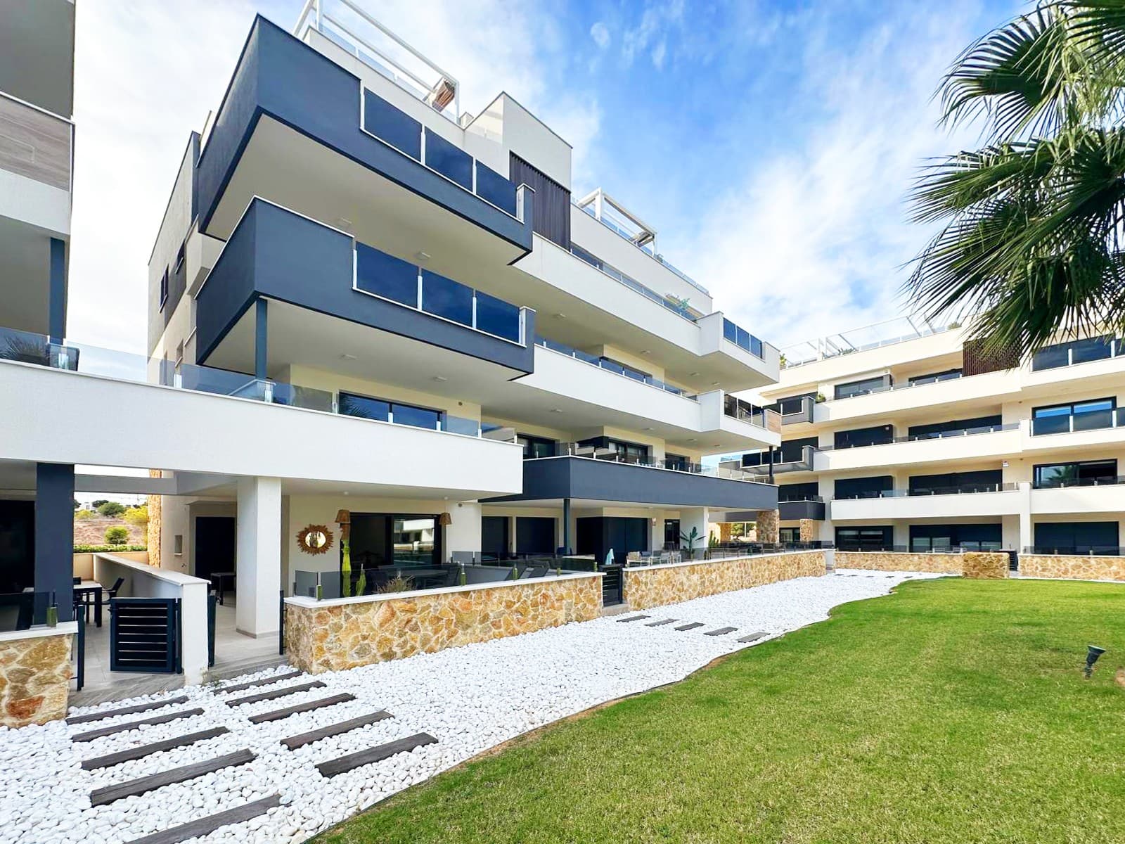 

This beautiful, fully furnished luxury apartment, built in 2023, offers the best lifestyle in a privileged setting. Greeted by a bright and welcoming atmosphere, due to its east/west orientation, the apartment, located on the ground floor of the building, offers a living room with 2 accesses to the outdoor terraces where you can enjoy private access to the the community gardens and pool area and the Mediterranean climate.

The kitchen is the epitome of luxury, boasting high-quality finishes and seamlessly integrating with the living room, creating an ideal space for sharing moments with family and friends

Two spacious double bedrooms, perfect for resting and relaxing, and two elegant bathrooms with underfloor heating, one of them en suite with bathtub for sophisticated comfort. 

The kitchen is the epitome of luxury, boasting high-quality finishes and seamlessly integrating with the living room, creating an ideal space for sharing moments with family and friends. From the living room, you access a charming 14 sq. m terrace, where you can enjoy unobstructed views and the Mediterranean climate.

This apartment includes several exceptional amenities: air conditioning with an Airzone system for personalized comfort, built-in wardrobes that optimize space, electric blinds, utility room and an additional 5 m² storage room on the garage floor for extra storage. It also includes disabled access and an elevator from the private underground parking area.

Make the most of the community facilities, which have everything you need for relaxation and staying active. There's an amazing pool, gym, jacuzzi and sauna – perfect for unwinding and keeping fit! The location is amazing! Just 4km from the beach and surrounded by all kinds of great services, including a ALDI supermarket just a 10-minute walk away, as well as doctors, schools, and parks, this is the perfect place to live.

This apartment is ideal for families and anyone looking for an active and comfortable lifestyle. It even includes access to children's areas in the same residential complex! Don't miss out on this incredible opportunity to live in this amazing apartment in Orihuela Costa.

Los Altos is an ideal holiday destination for the whole family at any time of year and a great place for permanent residence.