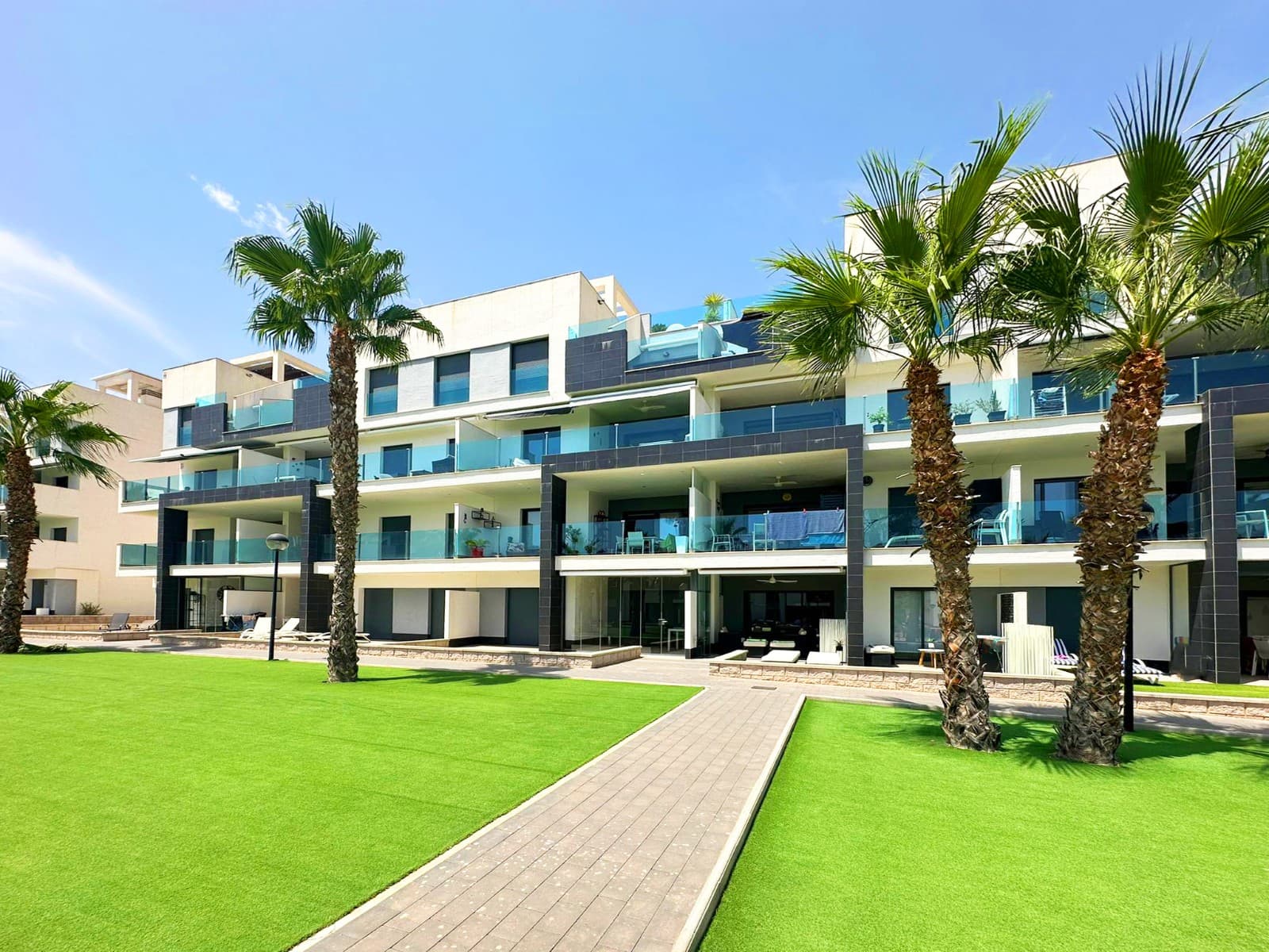 OASIS BEACH XII - We are thrilled to present this incredible 3-bedroom apartment in the highly sought-after Oasis Beach XII residential complex. Boasting a south-facing aspect that is simply perfect, this 103-square-metre built, luxury partment is the ultimate fusion of modern elegance and relaxing comforts.You're going to love the stunning views of the lush garden and sparkling outdoor pool! And you can enjoy them from the comfort of your own home!This sanctuary of comfort and sophistication is simply stunning! It's equipped with air conditioning to keep you cool and fully furnished with high-end appliances. Inside, you'll find a kitchen, living room and dining room, as well as three bedrooms and two bathrooms, one of them en suite.The terrace, accessible from the living room and master bedroom, is the perfect place to relax in the sun or enjoy al fresco dining. You can open or close part of it according to your needs, making it a versatile and enjoyable space.You'll love the convenience of your very own private storage room and underground parking space! The entire complex is completely enclosed and accessed via an electronic entry system, offering residents greater peace of mind and convenient on-site parking. That's not all – you'll also have access to the best community facilities around, including an outdoor fitness area and a wellness centre with a sauna and jacuzzi.Built in 2019, this apartment is the epitome of excellence in design and quality. It offers an unparalleled lifestyle in one of the most sought-after destinations on the South Costa Blanca – a true gem.

Don’t Let Opportunity Pass You by, contact us for a personal viewing.