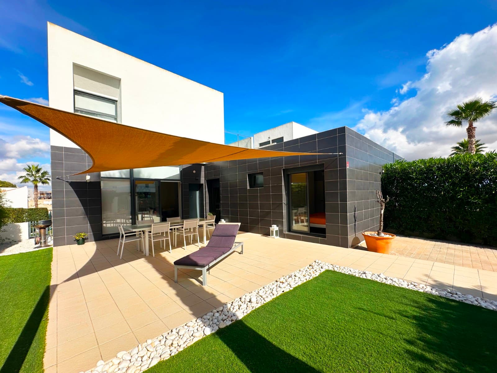 The property boasts three bedrooms and two bathrooms, situated within the renowned and highly regarded LA FINCA GOLF and SPA RESORT, in close proximity to ALGORFA on the COSTA BLANCA SOUTH.Upon entering the grounds of the villa, you will find a private drive to the right. To the left, you will find a beautifully landscaped garden, featuring grassy areas, pebble beds and colourful plantings. The villa features a wrap-around lower terrace that provides ample space for alfresco dining and is equipped with a canvas awning for shade. The villa's south-facing orientation is complemented by a courtyard terrace, providing a pleasant setting for relaxation with family and friends.

The property's living area is defined by its ceiling height, creating an expansive ambience, while the glass frontage allows for an abundance of natural light. The current owners have created a relaxing lounge area, followed by a dining area. A modern kitchen and island worktop are located at the far end. The entire space is designed to flow well and create a distinctive ambience. From the kitchen, there is a corridor that provides access to the first guest bedroom. The room is a good size and features fitted wardrobes and air-conditioning. It is followed by a family shower room. On this level, there is also the second guest bedroom, which is slightly larger than the first and has fitted wardrobes, air-conditioning and access to the lower terrace. Returning to the living area, a stairway at the far end provides access to the upper level. Upon reaching the landing, you will find a shower room to your left, followed by the master bedroom, which is the largest of the three bedrooms. The property benefits from fitted wardrobes, air-conditioning and glass sliding doors that provide access to an upper terrace. This Villa is designed to maximise natural light and offers complete privacy for residents. From here, you will enjoy great views. 

Upon reaching the landing, you will find a shower room to your left, followed by the master bedroom, which is the largest of the three bedrooms. The property benefits from fitted wardrobes, air-conditioning and glass sliding doors that provide access to an upper terrace. This Villa is designed to maximise natural light and offers complete privacy for residents. From here, you will enjoy great views.

This exceptional villa features private access to the shared gardens and two swimming pools. The property is well-situated within walking distance of a golf course and its amenities, and a short drive from local amenities, including restaurants, shops and bars. However, should you wish to spend a day at the beach, it is only a 15-minute drive to either Moncayo Beach or Guardamar. Should you be considering La Finca, the reasons for its popularity are clear. Its location is highly desirable, and the clubhouse is renowned for its warmth and hospitality. The course has been expertly crafted by a leading professional and boasts a high calibre, set within a stunning location amidst the mountains and the coast. The region's climate is among the most pleasant in Europe, offering year-round sunshine and convenient access to amenities.