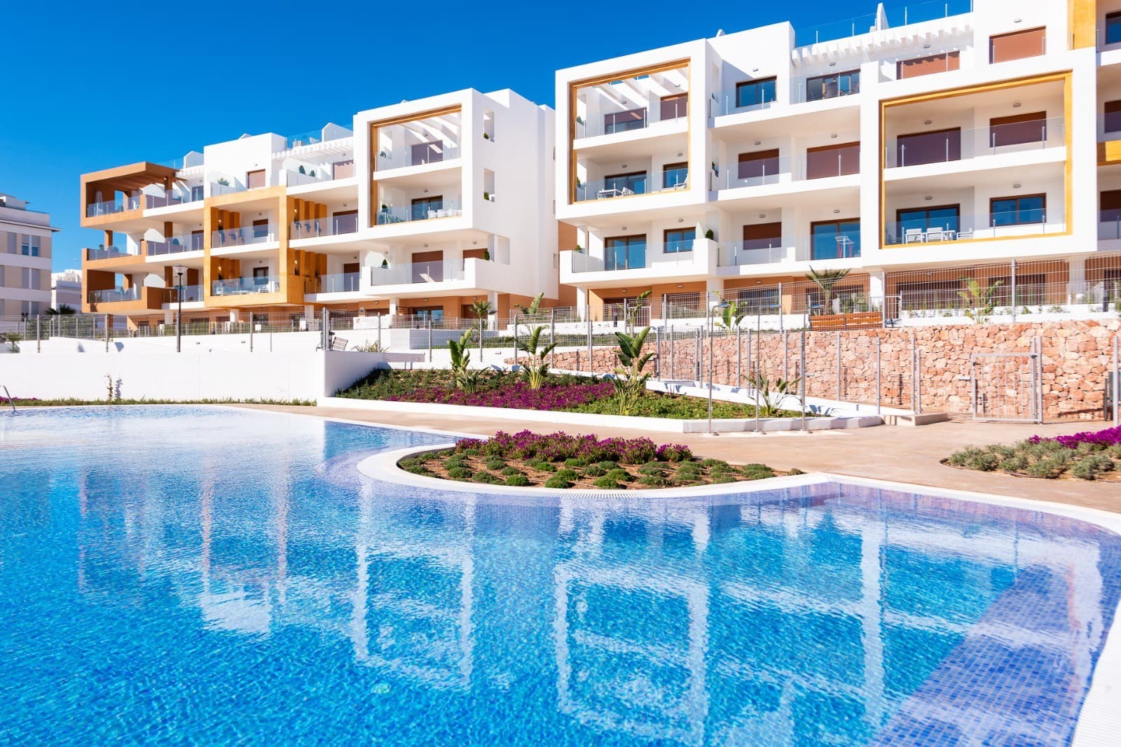 Beautiful 3 bedroom Apartment for Sale in Orihuela Costa

Located just an 8-minute drive from the stunning beaches of Orihuela Costa and 45 minutes from Alicante Airport, this modern apartment offers the perfect combination of comfort, luxury, and location. The apartment is ideal for those seeking a peaceful, sunny home with easy access to both the beach and the city.

With 3 spacious bedrooms and 2 bathrooms, this apartment offers plenty of space for the whole family. The built-in wardrobes provide ample storage and contribute to the sleek, modern design of the property. The apartment is southeast-facing, allowing you to enjoy plenty of natural light and a pleasant temperature throughout the day.

The kitchen is fully equipped with modern appliances, so you can start enjoying the convenience of cooking right away. Additionally, the apartment offers air conditioning and ventilation, ensuring a comfortable indoor climate all year round. The property is further enhanced by storage space within the apartment, allowing you to easily keep your belongings organized.

This apartment is sold fully furnished, so you can move in immediately and start enjoying the Spanish lifestyle. The communal garden and pool offer a great space to relax and soak up the sun, while experiencing the benefits of a quiet and well-maintained living environment.

Whether you're looking for a vacation home, an investment property, or a permanent residence in Spain, this apartment offers everything you need. The location in Orihuela Costa provides an excellent quality of life, with shops, restaurants, and of course, beautiful beaches all within easy reach.

Built in 2019, this apartment offers the modern amenities you expect, combined with the charm and tranquility of the region. Contact us for more information about this beautiful property, the buying process, or to schedule a viewing. We are ready to help you find your dream home under the Spanish sun.

Contact us now and book your appointment.