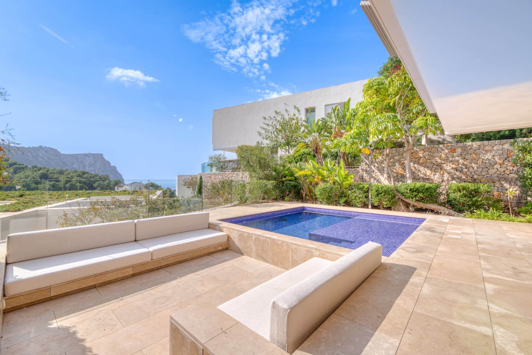 What is there better than to live in a modern, spacious villa, which offers splendid sea views and has its own pool? Find out more about this dream property in the renowned GRAND FOLIES complex south-west on the island.The modern villa offers approx. 280 m² of living space (approx. 493 m² constructed area) on the first floor with a very spacious living / dining area with open kitchen, guest WC and patio (5m²-). From this living level there is access to the outside area with covered terrace (41m²), private swimming pool (20m²), lounge area (15m²), further open terrace and sea and mountain views. On the second floor there are three bedrooms, each with its own en-suite bathroom and dressing area. All three bedroom suites offer fantastic views of the mountains and the sea. A special feature of this house is another large open space on the second floor with adjoining utility room and guest WC, which could be converted into a 4th bedroom with en suite bathroom. In the basement there is a technical room, further rooms for free use and direct access to the underground garage, where there is a private parking space. There is another uncovered parking space in front of the house entrance. The communal area offers beautifully landscaped gardens, a large pool area with sea views and fitness room, as well as a clubhouse with concierge service, heated indoor pool, whirlpool, dry sauna, steam sauna, further fitness room, offices for private use and a bar area with a beautiful outdoor terrace.The modern luxury residence New Folies is located in the popular Cala Llamp bay in Port d'Andratx in the southwest of Mallorca. The bay is known for the Gran Folies Beach Club with direct sea access, restaurant, bar and swimming pool. The harbor of Port d'Andratx is only a few minutes away by car, but is also easily accessible on foot. Here you will find a variety of restaurants, bars and boutiques. In the neighboring village of Camp de Mar there is a fantastic sandy beach and the famous Golf de Andratx golf course. The island's capital, Palma de Mallorca, is around 25 minutes away by car.Organize your viewing with us now and don't wait until somebody else buys this stunning villa! Online viewings can be also arranged.