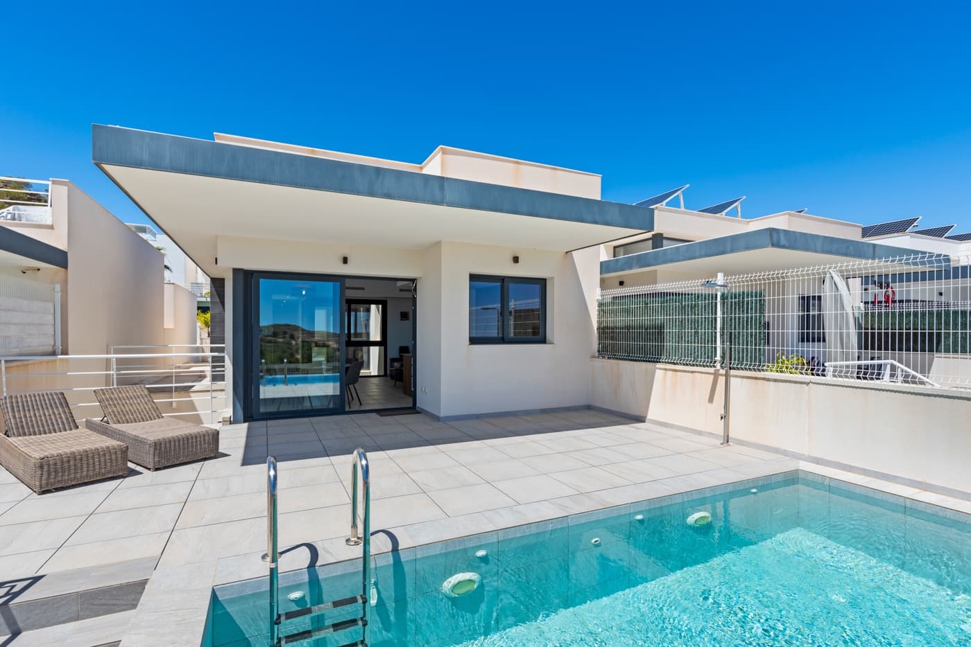 Living in all luxury, a gated community, beautiful views and a second guest house in the basement, perfect for large families or do rentals.

Come see this recently completed, virtually new home in Altos de San Miguel de Salinas. A beautiful detached villa with infinity pool, stunning views over the sky-line of Torrevieja and Laguna Rosa, the salt lake of Torrevieja. A real eye-catcher for lovers of space, luxury and tranquility.

The house is divided into two levels. The first floor is separate, but also combined to reach through an extra porch.

First floor;

As you drive in, you walk past the house into the living room. Through the large windows, the views are immediately striking. The spacious living room with open kitchen is equipped with all necessities. Walking to the rear of the house, here is a separate guest toilet located, with opposite access to the first bedroom with en-suite bathroom. At the very back of the house are located the next two bedrooms with shared bathroom.

Level -1;Through a second (shared) porch is also the lower floor to reach. Also this floor has a living room with spacious open kitchen which is again equipped with all necessities. Also this floor is equipped with two bedrooms, one with en-suite bathroom, and the other with a spacious walk-in closet. Due to several daylight entrances, there is also more than enough natural light on this floor.Details:- Plot; 260;- Living area; 223 m²- Year built; 2020- 5 bedrooms;- 4 bathrooms;- Guest toilet;- Infinity pool with beautiful views;- Private parking;- Fully finished kitchen & bathroom;- Equipped with all the necessary appliances;- Fully furnished.Property tax (IBI, estimate): € per yearCommunity: € per yearAcceptance: negotiableThis presentation is informative and without obligation. No rights can be derived from any inaccuracies.