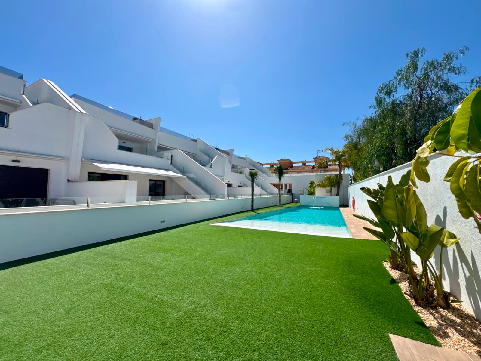 Discover this superb ground-floor apartment, ideally located in the charming Spanish village of Pilar de la Horadada, in the heart of the highly sought-after Costa Blanca South.Offering two bedrooms and two bathrooms with underfloor heating, this property impresses with its generous proportions and elegant ambiance. Outside, a spacious west-facing terrace of approximately 35 m² and a large awning offer unobstructed views of the residence's swimming pool.The apartment is part of an intimate residence of only 18 units, guaranteeing peace and quiet. Residents also enjoy well-maintained communal areas, a gently sloping communal swimming pool, and secure bicycle storage. For those seeking tranquility, the community does not accept new applications for tourist licenses.Sold fully furnished and constructed with high-quality materials, this property offers top-of-the-range amenities: underfloor heating in the bathrooms, electric shutters opening onto the terrace, a reverse osmosis system for purified drinking water, and a private covered parking space.Its location is particularly desirable: all amenities are within walking distance (shops, restaurants, and a pharmacy are just 500 meters away), while the magnificent sandy beaches of the Mediterranean are only 3 km away.Don't wait any longer to discover this exceptional property—contact us now for more information or to arrange a viewing!Community fees: €67/monthIBI: €243/year