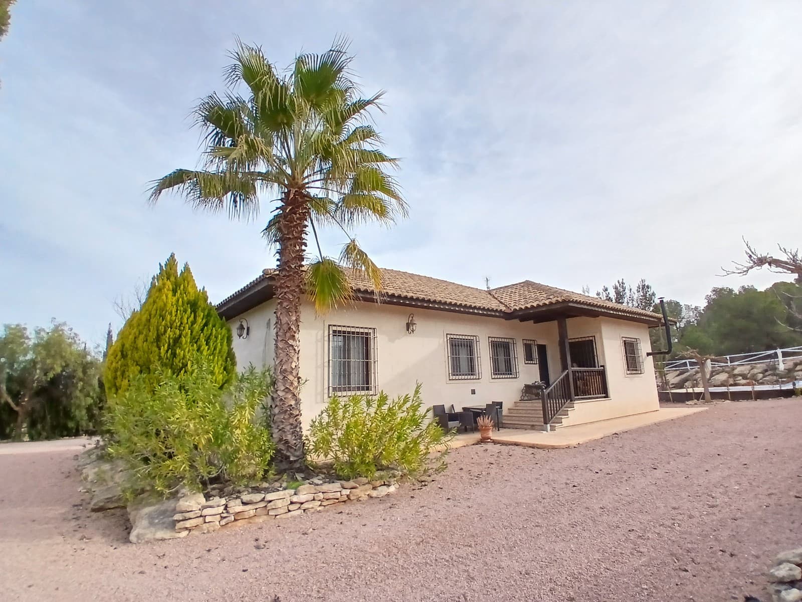 A business opportunity or just a dream come true. This ranch was build with love and with high quality materials. 

Private area:There is a big villa of 165m2 with 4 bedrooms of which one is used as an office. The master has an ensuite bathroom and airconditioning. The villa has 2 more guest bathrooms, a laundry room, a large independent kitchen and dining room and a comfortable living room with pallet stove. The house has an oil central heating and thermoglazed wooden tilt-and-turn windows with shutters and fly screens. There is also a large private pool with lounge area and pool bar.

Tourist area:The tourist area has 4 bungalows, each with a double bed, a bathroom and independent gas boilers for hot water and hot and cold airco units. Each bungalow has a small terrace overlooking the wooden built up pool. There is also a saloon of approximately 150m2 with bar and outside covered terrace. 

Equestrian facilities:There is a good size riding arena of 20x40m with stables (8 boxes 4x3m each) and paddocks, as well as a large insulated tack room, a workshop, a track and a hay storage. There is a REGA for 17 horses which can be extended. There is also an outdoor his and hers toilet. 

The property has irrigation water, 2 water deposits (20.000 + 10.000 liters) mains electric and a 20kwh solar installation with 10kw batteries that is less then 2 years old. There are also 2 sceptic tanks. 

Last but not least, there is a large parking space, a herbal garden and an area to play outdoor games like archery and cornhole.