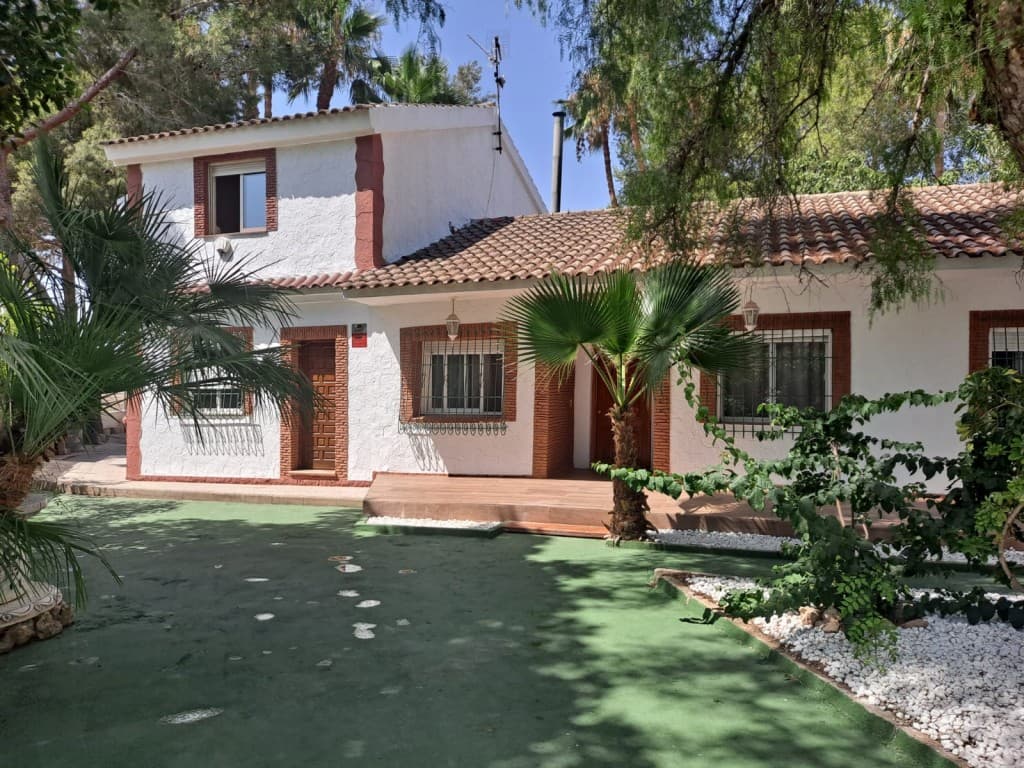 For Sale: 12,000 m² Finca in OrihuelaDiscover this magnificent finca located in a peaceful setting in Orihuela, perfect for nature and space lovers. The property consists of several distinct elements, offering various possibilities.A driveway leads to the house and its beautiful 1,100 m² fully fenced garden, shaded by various trees, offering an ideal space for relaxing moments, outdoor meals, or simply strolling. There is a carport for the car, a pool, and a storage room. An additional non-constructible plot of approximately 10,500 m² is ideal for planting.Interiors: The 250 m² house spans two levels:Ground Floor:Large living/dining room with a fireplaceIndependent kitchenHallway leading to:1 bathroom3 bedrooms, including a master suite with its own bathroomParquet flooring throughout the ground floorUpper Floor:Granite staircase leading to the upper floor1st bedroom with two sliding windows and a balcony overlooking the back of the garden1 bathroom2nd bedroom with a view of the front entrance of the houseThe house's windows are made of white PVC, offering excellent insulation.Location: Situated in a very quiet area, this property is only a 5-minute drive from amenities.For more information or to schedule a visit, please contact us. This finca is a unique opportunity to acquire a spacious and versatile property in an idyllic setting.