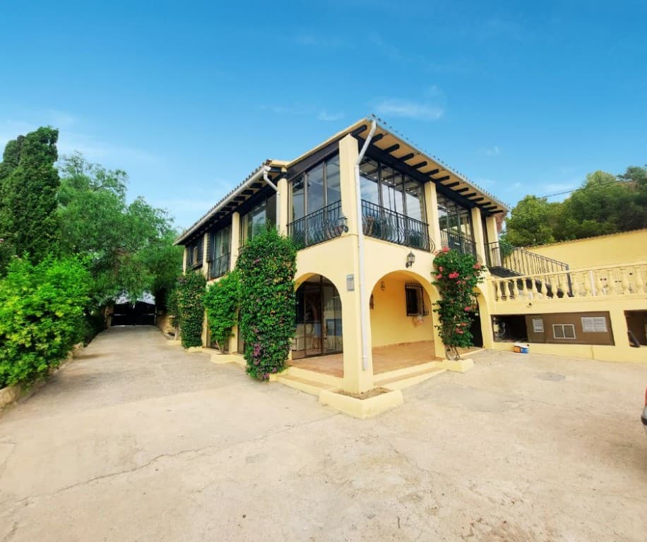 We are thrilled to present this spectacular country estate, guaranteed to captivate you at first sight.The recently renovated home blends rustic charm with modern comfort, boasting an eclectic decor that creates a warm, inviting atmosphere. With 4 spacious bedrooms and 4 well-appointed bathrooms, the villa’s bright and airy interiors provide the ultimate in Mediterranean living. The property is licensed to accommodate up to 11 horses and includes several riding arenas, 6 independent stables with automatic feeders, and a meticulously maintained sand track designed for training and competitions. Current REGA license and equestrian facilities on site.There’s also a warehouse and storage room for all your equipment, along with offices for daily management and a shed offering multiple independent living areas.This property stands out as one of the most unique and desirable on the market, offering a true Mediterranean sanctuary.Discover this stunning country estate, a serene retreat nestled in the picturesque countryside, built in 1980. This exceptional property is a paradise for horse enthusiasts and country living lovers, offering facilities for keeping 11 horses and domestic poultry. With its luxurious 497 m² main house, this estate also presents an outstanding opportunity for investors to create a country equestrian club or a charming boutique hotel.As you enter the estate, a beautifully landscaped garden and a welcoming driveway lead to ample parking. The property comprises five distinct buildings, including the elegant main house, which features multiple entrances and exits for privacy and convenience.The main house is spread over two spacious floors. The grand entrance opens into a spacious dining room, perfect for entertaining guests, and leads to a fully equipped separate kitchen designed for culinary excellence. The highlight of the main floor is the expansive living room, filled with natural light and offering breathtaking views of Altea’s landmarks, the glistening sea, majestic mountains, and surrounding nature. This room extends to a large terrace, an ideal spot for savoring the scenic beauty, with steps leading down to the manicured courtyard.The main floor also includes a luxurious main bedroom with an en-suite bathroom for ultimate comfort and privacy, along with a convenient guest toilet.A graceful staircase from the dining room ascends to a versatile space, perfect for a home office or creative studio.The lower floor features another inviting living room with a cozy fireplace, two additional bedrooms, a well-appointed bathroom, and another main bedroom. This living room also opens onto a lower terrace.The private courtyard is a true oasis, featuring a refreshing swimming pool for leisurely swims on warm days. A charming small house in the courtyard offers a studio with a bathroom, perfect for guest accommodation, staff quarters, or a home office. The estate is adorned with several fruit trees, adding a natural touch to the landscape.For equestrian enthusiasts, the estate features meticulously maintained horse stables, complemented by a dedicated building for poultry. The facilities are enhanced by a nearby bathroom with a shower, as well as a versatile room that can be converted into a dressing area.Additionally, a separate entrance adjacent to the stables provides convenient access for animals. This magnificent estate beautifully blends the charm of country living with modern amenities, offering a unique opportunity to enjoy a luxurious rural lifestyle while remaining close to the vibrant town of Altea.For more information, please contact us today and book your private viewing!