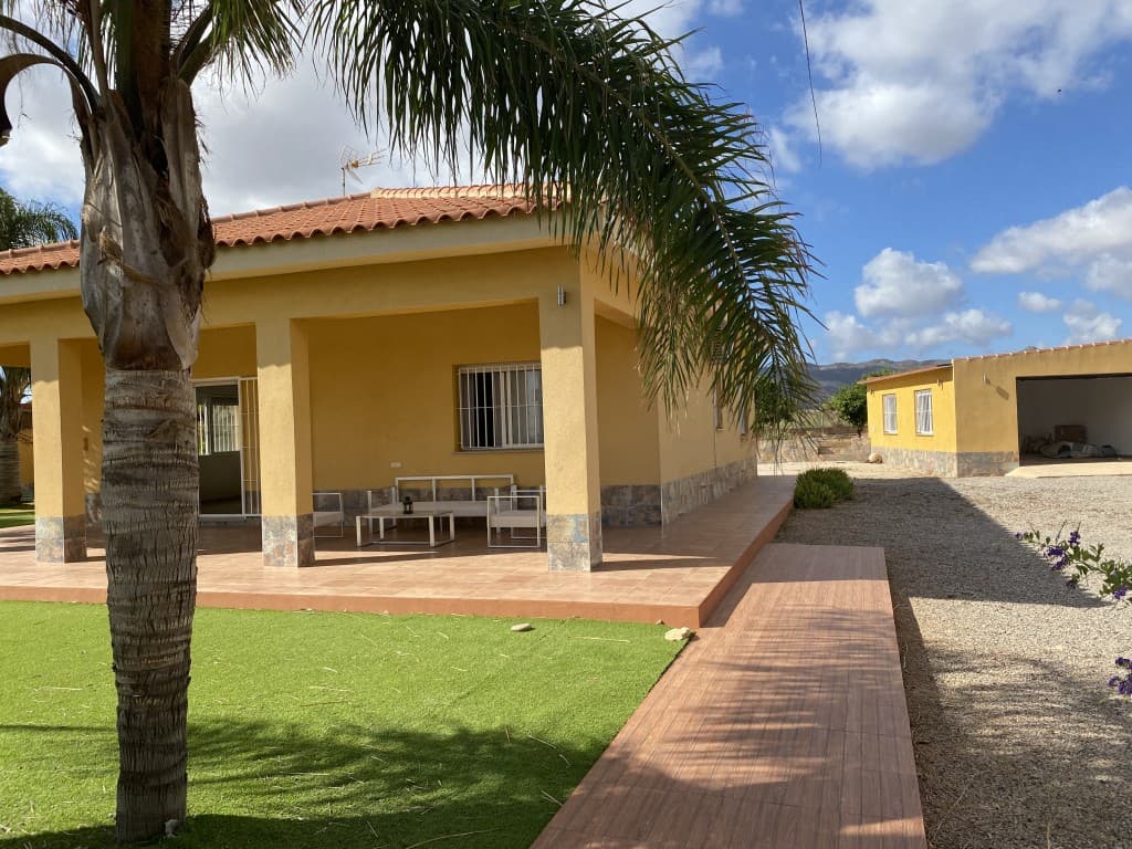 Country House in PJ MOLINO LEON, LA MAGDALENA (Cartagena)Discover this charming house located in Molino León, just a few minutes from Cartagena, set on a 1,376 m² plot, with 112 m² of usable space, fully independent and secure.The entrance is through an electric gate or door, providing access to a vast property. You will find a spacious garage with an automatic door, capable of accommodating two cars, along with additional storage space.The main house welcomes you with its porch and tiled terrace that surrounds the property. Access to the interior is through a large sliding glass door at the front or a door located at the rear of the house.Inside, there is a living-dining room with a modern, fully equipped open kitchen, including an oven, ceramic hob, dishwasher, microwave, extractor hood, wine cooler, and built-in cabinets.The sleeping area, separated by a hallway, includes:One bedroom with a built-in wardrobe,A bathroom equipped with a shower, toilet, vanity unit, and storage cabinet,A second bedroom, also with a built-in wardrobe.Outside, a garden adjacent to the house is planted with fruit trees and palm trees, perfect for moments of relaxation. At the back of the house, you'll find a second terrace with a barbecue and fireplace, ideal for enjoying outdoor meals. An outbuilding houses a shower, toilet, and storage space.The property also offers the possibility of installing a swimming pool, ideal for enjoying sunny days.At the back of the plot, there is an orchard with lemon and orange trees, complete with its own irrigation system, rounding out this exceptional property.The house is equipped with split air conditioners to ensure your comfort.A true opportunity for nature lovers and those seeking tranquility, while remaining close to the amenities of Fuente Álamo and the city of Cartagena.Cartagena is a port city located in the region of Murcia, in southeastern Spain. Steeped in history, it is one of the most important cities on the Spanish Mediterranean coast, with a rich cultural and architectural heritage that attracts visitors year-round.In addition to its historical heritage, Cartagena is surrounded by stunning nature. The fine sandy beaches along the Costa Cálida are popular for swimming, diving, and other water sports. The nearby Calblanque Regional Park offers hiking trails through protected coastal landscapes.