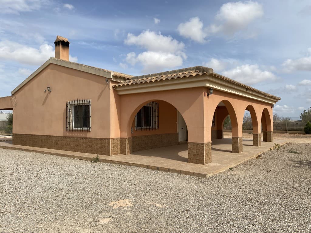 For Sale: Country House in BalsapintadaDiscover this beautiful country house located in a peaceful setting near the municipality of Fuente Álamo, in Balsapintada. Built on a large 2827 m² plot, it offers a spacious garden, ideal for creating a vegetable patch, keeping animals, or designing a decorative garden.The main house, with an area of 109 m², features a bright living-dining room with a fireplace, a fully equipped kitchen, three bedrooms, and two bathrooms (one en-suite). You will also enjoy two porches overlooking the pool and the orchard.At the back, a secondary house of 50 m² includes a living-dining room with a kitchen, one bedroom, and a bathroom, perfect for hosting friends or family members seeking more privacy.The property also boasts a swimming pool, a barbecue area, an outdoor bathroom, a storage room, and a separate garage. Additionally, it is just steps away from all necessary services.Balsapintada is a peaceful village surrounded by rural landscapes, only 15 minutes from Murcia and close to Corvera Airport. Its close-knit community, local traditions, and numerous outdoor activity opportunities make it an ideal place for those seeking a quiet life while staying connected to urban amenities.Don’t wait to visit this unique property!