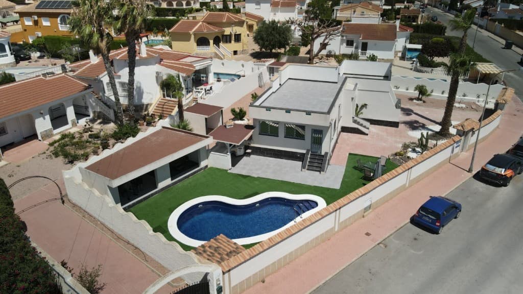 Stunning Fully Renovated Villa in the Heart of Ciudad QuesadaDiscover this beautifully renovated, detached villa located just a short 3-minute stroll from the vibrant main street of Ciudad Quesada. Combining modern design, generous space, and exceptional outdoor living, this 138 m² villa sits on a private 677 m² plot, offering the perfect balance of luxury, comfort, and convenience.Interior Highlights: Step inside to a bright and spacious living room featuring a charming fireplace, ideal for relaxing evenings. The modern kitchen, complete with a sleek breakfast bar and Silestone countertops, offers ample space for entertaining and family gatherings. The villa boasts 3 large bedrooms, a stylish bathroom, and an additional guest toilet.On the side of the house, a separate self-contained studio awaits, complete with its own living area, kitchenette, and bathroom – perfect for guests, extended family, or even rental potential.Outdoor Oasis: The outdoor spaces of this property are nothing short of spectacular. The fully landscaped garden has been designed for low maintenance and ultimate enjoyment. Key features include:A private swimming pool for sunny days and relaxationA luxurious covered patio with a jacuzzi spa for year-round indulgenceAn outdoor kitchen and barbecue area ideal for alfresco dining and entertainingTwo practical storage rooms and a convenient outdoor showerA roof solarium spanning the entire house, offering breathtaking views and endless possibilities for sunbathing or creating an additional relaxation areaUnbeatable Location: Positioned in the heart of Ciudad Quesada, this villa provides unparalleled access to local amenities, including supermarkets, restaurants, bars, and shops – all just 100 meters away. The motorway is a quick 5-minute drive, connecting you to Alicante Airport within 35 minutes. Plus, the region’s beautiful sandy beaches, renowned golf courses, and healthcare facilities are all within easy reach:Beach: 20 minutes by carGolf Course: 15 minutes by carShopping Centers & Hospital: 15 minutes by carFeatures at a Glance:Private pool & jacuzzi spaOutdoor kitchen & BBQ areaSelf-contained guest studioRoof solarium & finished landscaped gardenSecurity features: burglar alarm, security cameras, reinforced door, and automatic gatesModern comforts: air conditioning, electric blinds, double glazing, and fiber internetWhether you’re looking for a permanent residence, holiday home, or an investment property, this villa offers everything you need to enjoy the Mediterranean lifestyle to the fullest.Schedule a viewing today and experience this exceptional home for yourself!