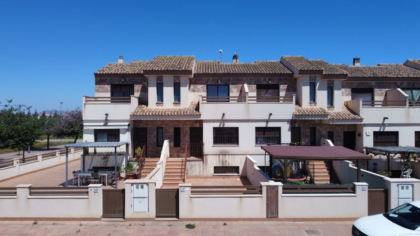 For Sale: Perfect Family Home with Sea View in Los AlcázaresDiscover this move-in-ready property in sunny Los Alcázares, ideal as a family home or as an investment for rental purposes. Perfectly located just one kilometre from the beaches of the Mar Menor and the charming marina, this home offers year-round sun, sea, and relaxation.The house is in excellent condition and features three bedrooms and two recently renovated bathrooms spread over two floors. On the ground floor, there is a bedroom and a bathroom, making it ideal for guests or for those who prefer single-level living. Upstairs, you’ll find two more bedrooms, one of which has its own terrace with stunning sea views.At the front of the property, there is a spacious south-facing terrace where you can enjoy the sun all day long while overlooking the coastline. At the back, there is another large terrace, partly covered—perfect for shaded moments during warm summer days.The kitchen has been fully renovated and is equipped with modern built-in appliances. Every room in the house has air conditioning with both hot and cold settings, ensuring optimal comfort throughout the year.A major highlight of this property is the large garage with an electric door, accessible via a communal area. It offers ample space for two cars and additional storage.This home combines comfort, space, and a prime location near the sea. A perfect choice for families or anyone looking for a solid investment on the Spanish coast.