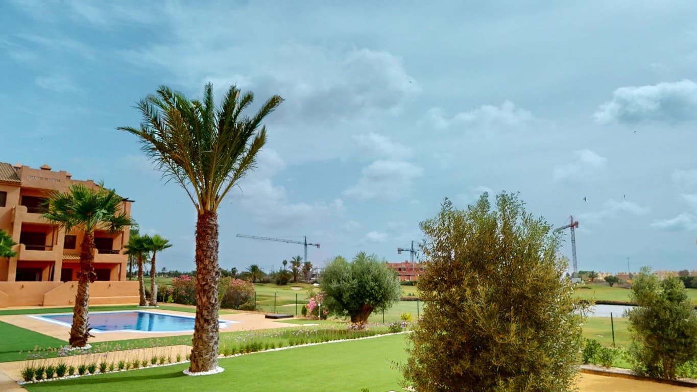 Customizable Apartments for Sale at Serena Golf ResortWe are also offering two ground-floor apartments at Serena Golf Resort that are ready for you to customize entirely to your own style. Sold without furniture or kitchen appliances, these properties offer a blank canvas for those who want to design their ideal living space from the ground up. Each apartment includes two bedrooms and two bathrooms, and is equipped with air conditioning for both heating and cooling. The east-facing terraces overlook the swimming pool and the scenic golf course, and provide direct access to the communal gardens and pool area via a private staircase. An underground parking space and a spacious private storage room of 2 by 3 metres are also included.These customizable apartments present an excellent opportunity for anyone seeking a property with great potential in a prime location.Contact us today to schedule a viewing and explore all the possibilities.