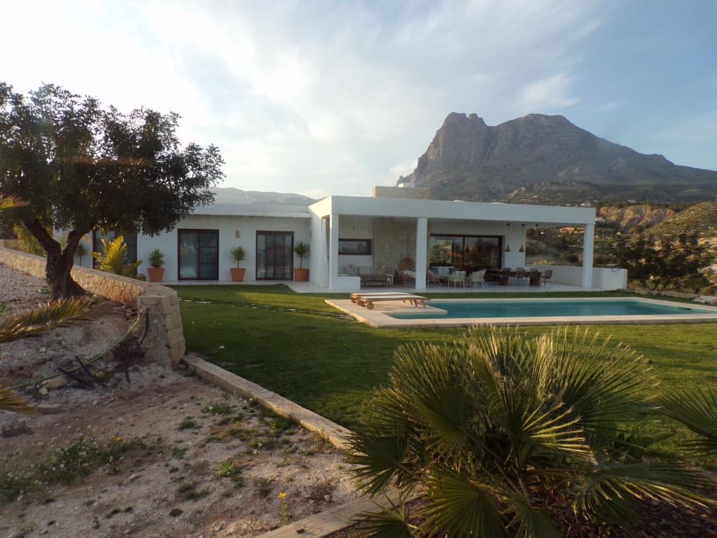 Luxury Rustic Mediterranean Villa with Sea Views in Finestrat. Discover this exceptional luxury rustic villa nestled in the hills of Finestrat, just minutes from the charming village and next to a prestigious golf course. Built in the timeless Mediterranean style, the property offers 350m² of elegant living space, surrounded by 25,000m² of private land with panoramic sea and mountain views.The villa features 4 spacious bedrooms, 3 modern bathrooms, a fully equipped independent laundry room, and high-speed fiber internet – perfect for remote work or living connected in serenity. The large outdoor area includes a private swimming pool, chill-out zone, and ample space for enjoying the peaceful natural surroundings. Goo oportunity also to do a bussiness like a glamping or similarWhether you're seeking a tranquil retreat or a stylish residence near the coast, this home offers both privacy and convenience, with Finestrat’s shops and restaurants just moments away.