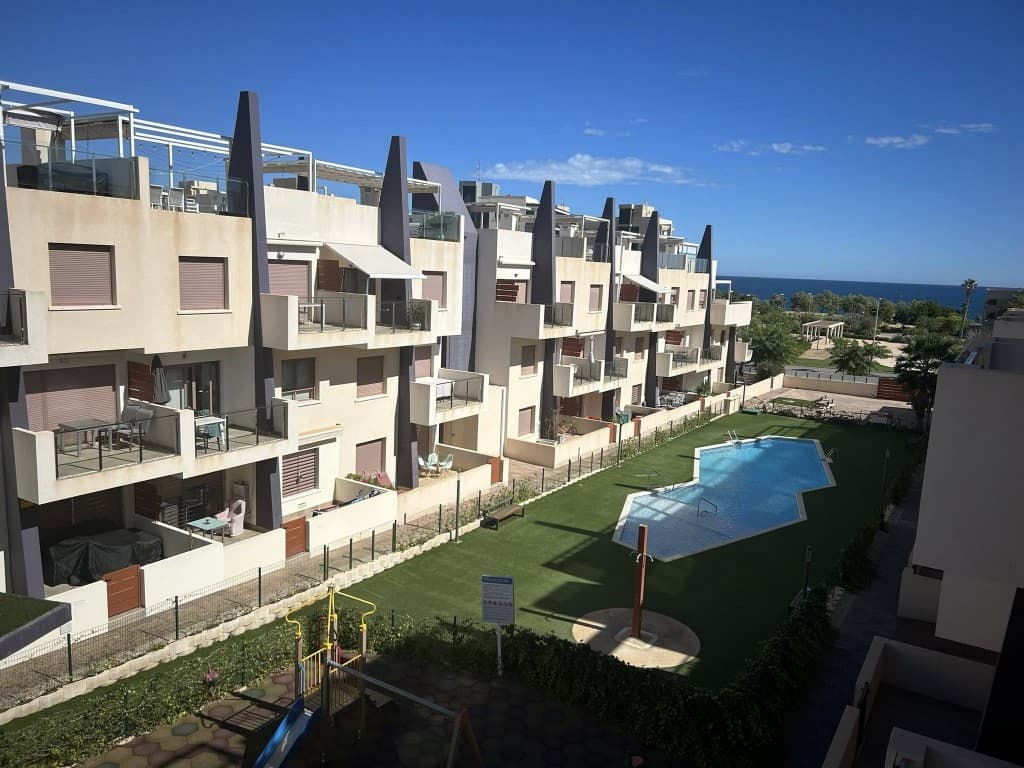 penthouse with ocean view. Discover this stunning penthouse with see view located in the charming town of Torre de la Horadada, just 100 m walk from the beach.This modern penthouse offers a comfortable living area of approximately 70 m², thoughtfully laid out with a bright living room, open kitchen, two spacious bedrooms, and two fully equipped bathrooms. Large windows provide plenty of natural light and a pleasant connection to the outdoors.One of the absolute highlights of this home is the outdoor space. In addition to a cozy terrace off the living room, the penthouse features a spacious private solarium of 70 m². Here you can fully enjoy the Mediterranean climate, with ample space for a lounge, outdoor kitchen, or jacuzzi.The complex offers a well-maintained, gated residence with beautiful green areas, two communal swimming pools, and a child-friendly environment. Thanks to its location just a few minutes’ walk from the beach, restaurants, and shops, this is the ideal place for both personal use and investment.In short, a unique combination of comfort, outdoor space, and a prime location on the Costa Blanca.