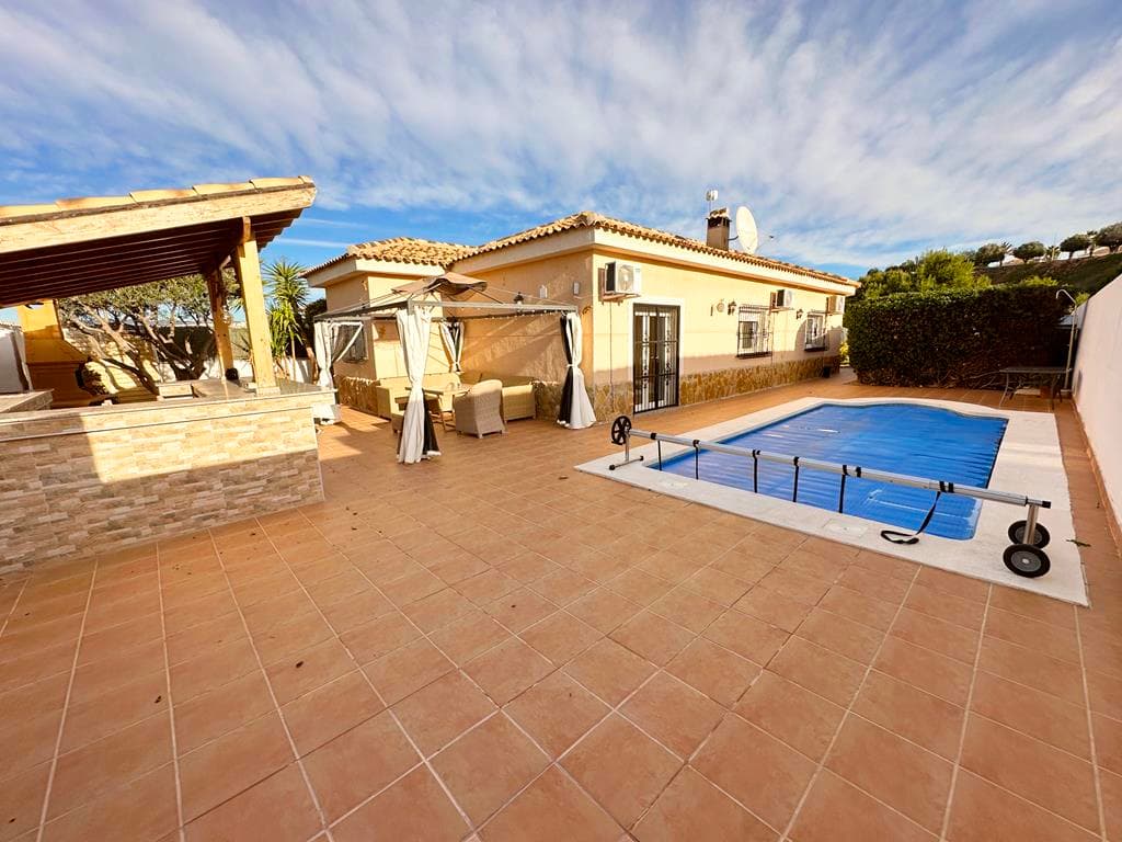 We are delighted to offer to market this gorgeous detached villa, on a large plot, on the Lo Santiago development.  The development is a 20 minutes drive from Murcia City, Corvera airport and the beaches of the Mar Menor.  A 5 minute walk on site is the fantastic New Yorks bar serving great food, a cafe and beauty salon.  The urbanisation is surrounded by several wonderful golf courses, El Valle, La Torre, Altaona and Hacienda Riquelme.The villa is extremely private and accessed either by an electric gate onto the driveway or through a front gate.  The villa is built on a large plot with gardens all around, with fruit trees, numerous seating areas, large private heated swimming pool (heater just installed) and fantastic bar kitchen area, perfect for entertaining.  You enter the property into the hallway with the kitchen in front of you.  This has been recently modernised with white units and built in washing machine and dishwasher and large American fridge freezer.  To the left leads to the huge sunny lounge diner with built in log burner and views over the pool.  The property does have aircon throughout and gas central heating.  A hallway leads to three double bedrooms all with fitted double wardrobes, a guest bathroom and the master has an ensuite shower room.  The 2nd guest bedroom has patio doors which open onto the pool area.