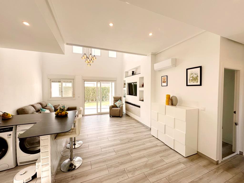 Take a look at this beautiful property. We are thrilled to offer this fully modernised Acebuche villa for sale on the wonderful La Torre Golf Resort.  No expense has been spared with this property.  The owners have extended the entrance area, added a storage room upstairs, fully retiled the solarium and added frosted privacy glass, opened up the living space with a brand new kitchen, new bathroom, rear tiled terrace with covered pergola and outdoor kitchen area, a huge shed (the perfect man cave!) and all new floorings and aircon throughout.  The garden has plenty of space to add a private swimming pool. The property is situated close to the Kings College entrance of the resort and close to one of the communal swimming pools.  Murcia airport is ten minutes drive along with the local village of Roldan.  Onsite you have a supermarket and various bars and restaurants in the resorts town centre.The property has off road parking and an spacious storage cupboard to the front of the property.  The stairs have been incorporated into the property and are situated to the right of the hallway with  large storage cupboard at the top of the stairs and glazed patio access onto the tiled terrace where you can enjoy gorgeous views over the orange groves and amazing sunrises.  The living space and kitchen have been opened up to create a more sociable living space with brand new kitchen and breakfast bar with built in oven, hob and microwave.  Patio doors lead to the tiled terrace and lawned garden.  To the left of the garden is an outdoor kitchen area with gas bbq and to the right a huge shed with tiled roof.  There are two double bedrooms both with fitted wardrobes and a separate family bathroom with walk in shower.  There is brand new aircon throughout, flyscreens on all doors and windows and a large storage cupboard in the living room.  This is a gem of a villa, the current owners have refurbished the property entirely.  Please contact us for a viewing appointment.