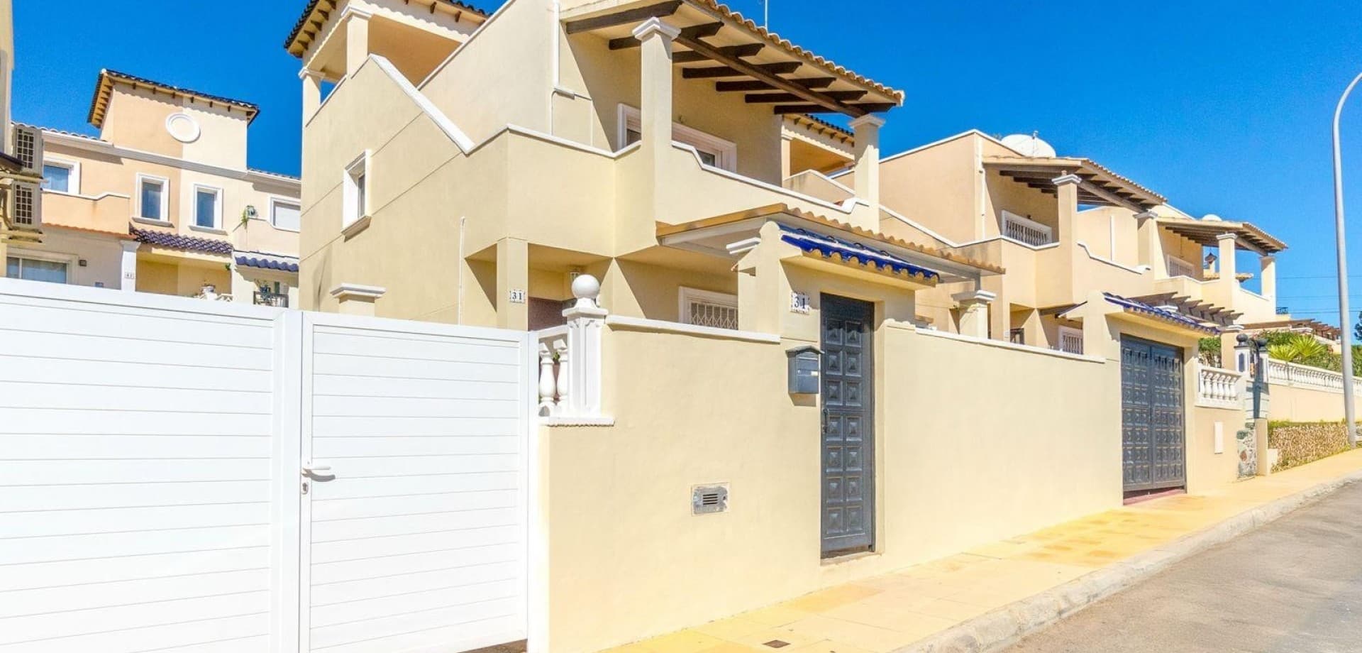 We are pleased to present this well-maintained, detached villa located in the sought-after residential area of Blue Lagoon, Villamartin.

This charming home features 3 bedrooms and 2 bathrooms, spread across a practical layout ideal for both full-time living and holiday use. The bright living area flows seamlessly into a fully equipped kitchen, while the bedrooms offer comfortable accommodation for family or guests.

Outside, you’ll enjoy a spacious ground floor terrace perfect for alfresco dining, as well as a private roof terrace boasting panoramic sea views — an ideal spot to unwind in the sun. Additional highlights include private off-road parking and access to a well-kept communal pool.

Set in a quiet yet convenient location, close to golf courses, beaches, and local amenities, this villa offers a relaxed Mediterranean lifestyle on the Costa Blanca.