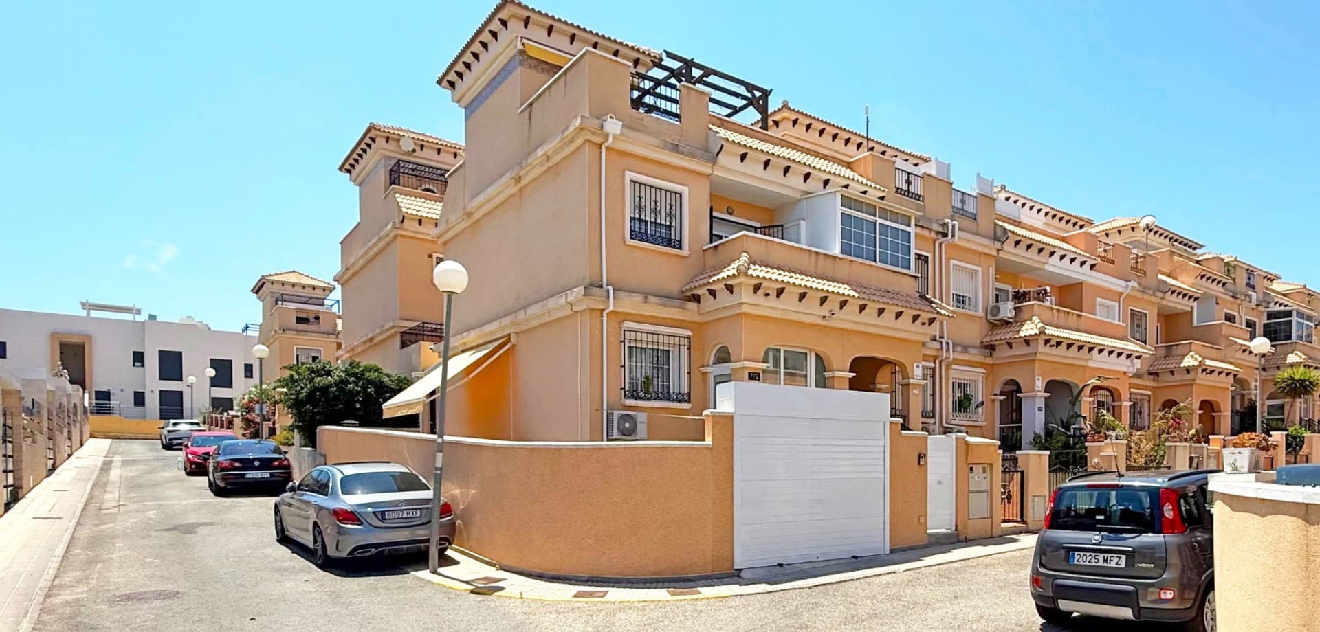 Welcome to this stunning, fully renovated townhouse located in the heart of Villamartin – one of the most sought-after areas on the Costa Blanca. Situated on a spacious corner plot, this home offers a perfect blend of indoor comfort and outdoor living.

The property boasts 3 bedrooms and 2 modern bathrooms, all tastefully upgraded to the highest standard. On the ground floor, you'll find a bright and open-plan living area, a sleek kitchen, and one of the bedrooms – ideal for guests or as a home office.

Step outside to the expansive private terrace, large enough to park a car inside the plot if desired. It's a fantastic space for entertaining, dining, or simply relaxing in the Spanish sun. From the master bedroom, enjoy direct access to a private balcony, perfect for morning coffee or quiet evenings. A spacious roof terrace offers additional outdoor space with panoramic views – ideal for sunbathing or creating your own chill-out zone.

The home is sold fully furnished and includes air conditioning for year-round comfort. Located in a well-maintained community with access to a beautiful communal pool, this property is ready to move in and enjoy.

Whether you're looking for a permanent residence, a holiday home, or a high-yield rental investment, this turnkey townhouse has it all.