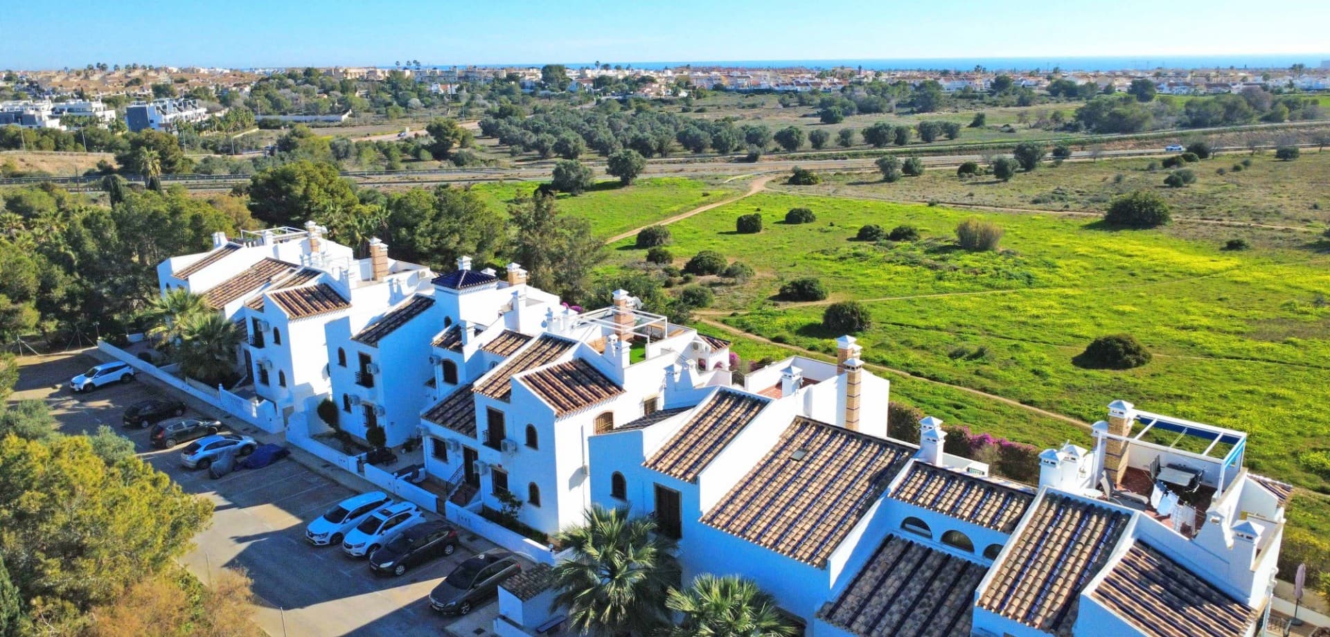 Located in the highly sought-after area of Villamartín, this attractive townhouse offers a perfect combination of outdoor space, open views, and an excellent location—ideal as a permanent residence, holiday home, or rental investment.The property features two well-proportioned bedrooms and two bathrooms, with a practical layout designed for comfortable living. The home enjoys a pleasant sense of space and natural light throughout.Outdoor living is a key highlight, with multiple areas to enjoy the Mediterranean climate. The property offers a private garden, a ground-floor terrace ideal for outdoor dining, and a spacious roof terrace—perfect for sunbathing, relaxing, or entertaining while enjoying open views over the nature reserve directly in front of the property, ensuring privacy and a peaceful setting.Situated within a secure gated community, residents have access to a well-maintained communal swimming pool, providing a refreshing retreat during the warmer months.One of the home’s strongest advantages is its walking-distance location to Villamartín Plaza, with its wide selection of restaurants, cafés, bars, and amenities, as well as close proximity to golf courses, shops, and services.This is a versatile property that combines location, outdoor space, and views, making it an excellent choice for anyone looking to enjoy the Costa Blanca lifestyle.