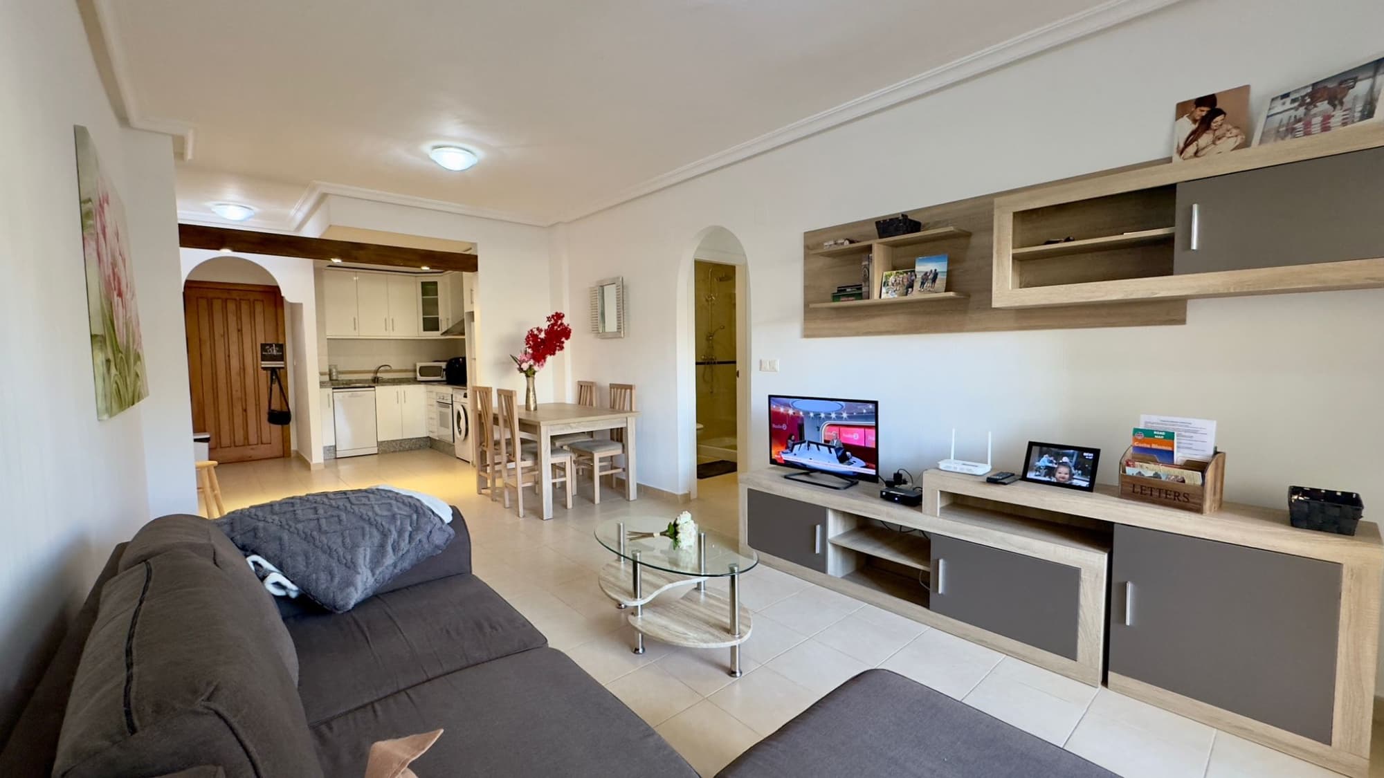 

This stylish ground-floor apartment with a spacious 28 m² terrace is located in the popular Las Filipinas neighborhood in Villamartín, Orihuela Costa . It offers everything you need for comfortable and carefree living on the sunny Costa Blanca .

 The house features three spacious bedrooms and two modern bathrooms , ideal for families, couples, or as an investment. The open-plan, fully equipped kitchen flows seamlessly into the bright and spacious living area. From the living room, you have direct access to the spacious terrace. All windows have roller shutters.

 The residence offers excellent facilities such as a fitness room , sauna , and a beautiful communal swimming pool surrounded by greenery—the ideal place to relax or cool off on hot summer days. The development also features a large, sunny roof terrace accessible to all residents.

 The apartment is sold fully furnished , so you can move in immediately and enjoy everything this property and its surroundings have to offer.

 Are you looking for a move-in ready home in a lively yet quiet neighborhood ? Please feel free to contact us for more information or a viewing!